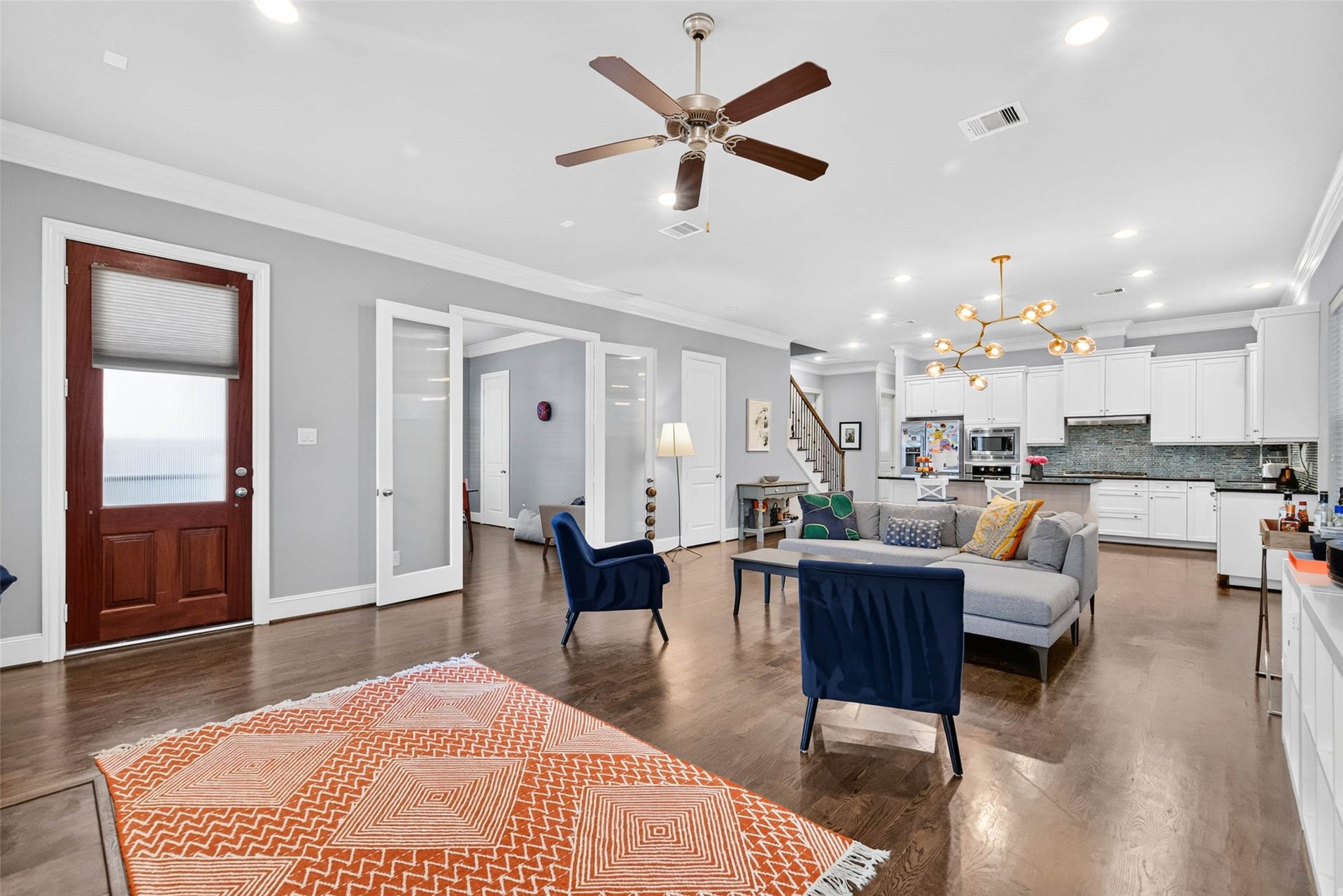 1207 Welch Street, Houston, TX 77006 A closer look at the home's thoughtful layout, with the front entry connecting the living room to the kitchen and adjacent dining room.