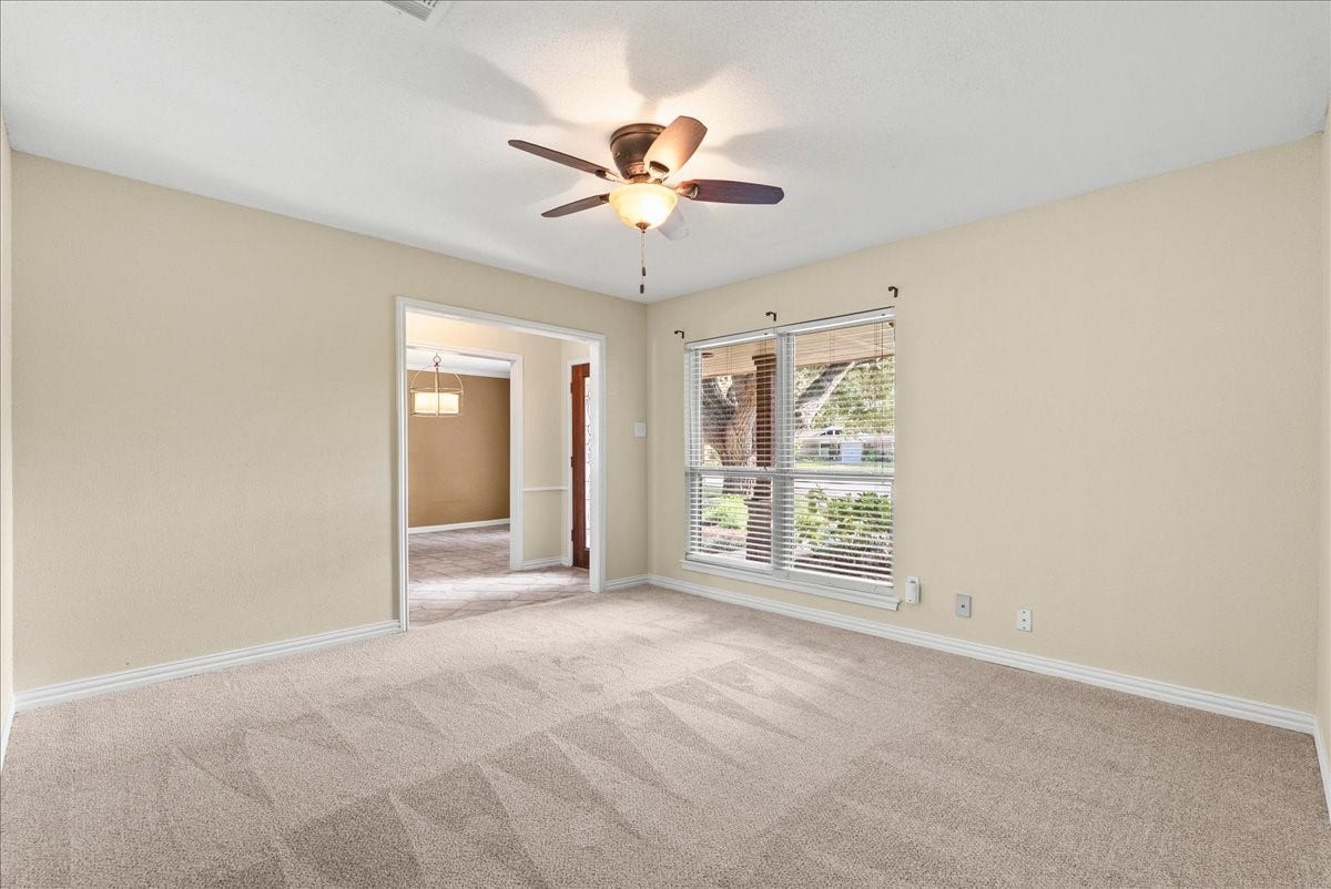 802 Riverside Drive, Alvin, TX 77511 Bright, spacious flex room room perfect for a home office, game room or extra entertaining area with large windows to invite natural light
