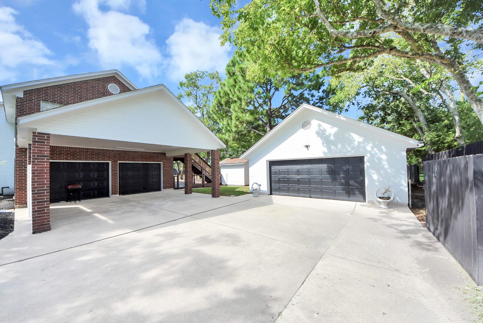 1910 Avenue L, Santa Fe, TX 77510 Main garage that can store up to 2 cars plus the 2-carport with also access to a detached garage that can be used different ways!