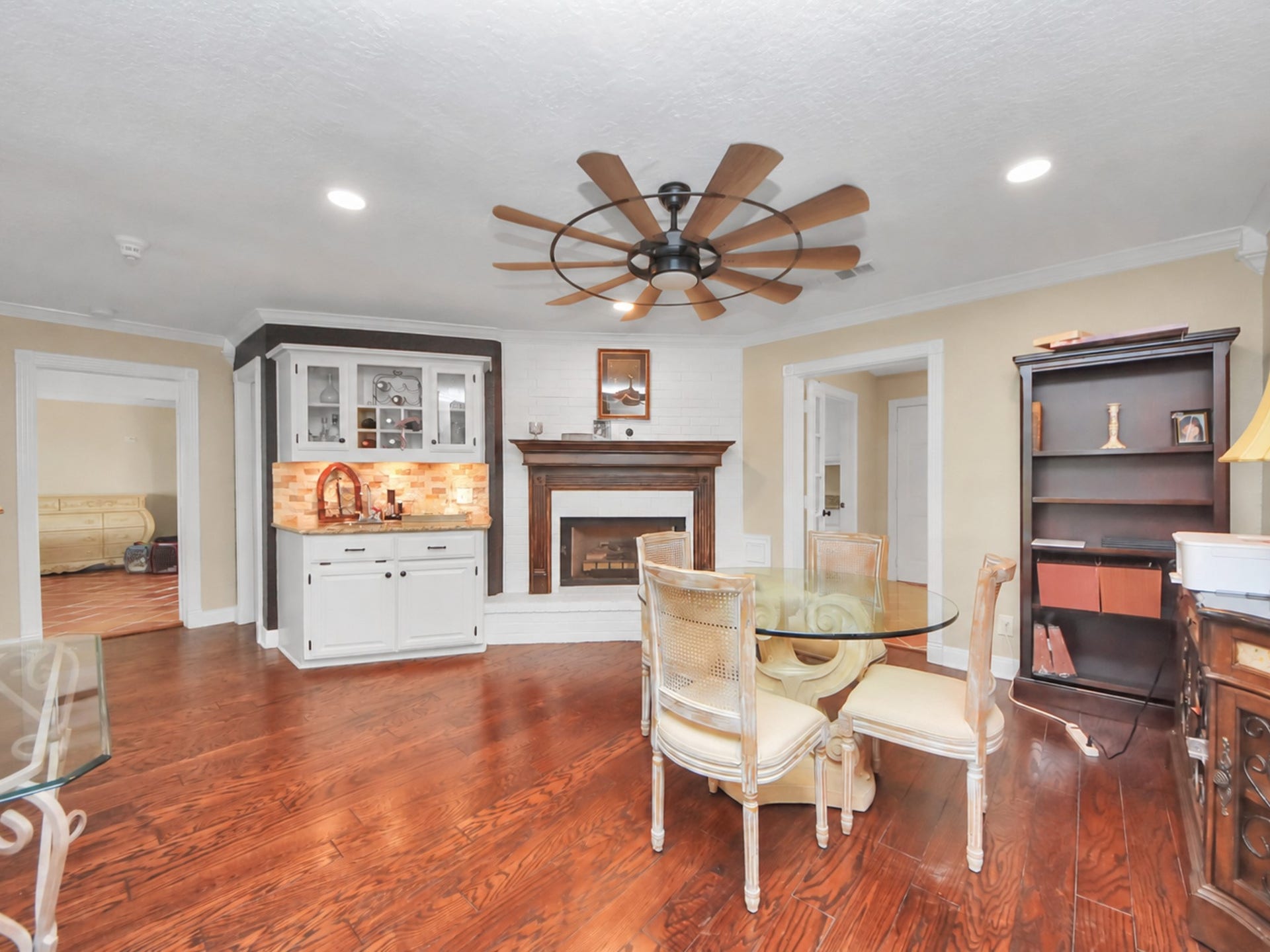 1910 Avenue L, Santa Fe, TX 77510 Main House main floor breakfast area with a beautiful fireplace!