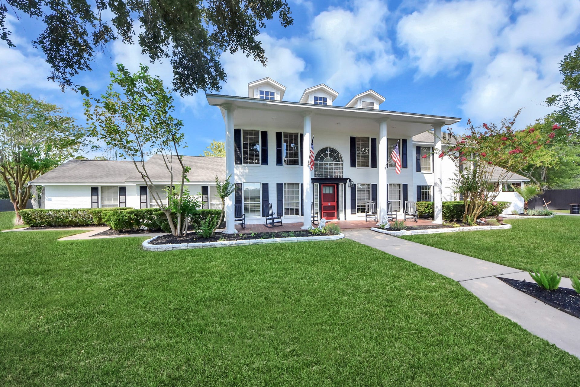 1910 Avenue L, Santa Fe, TX 77510 A colonial style home that makes everyone turn and look with absolutely stunning white brick!