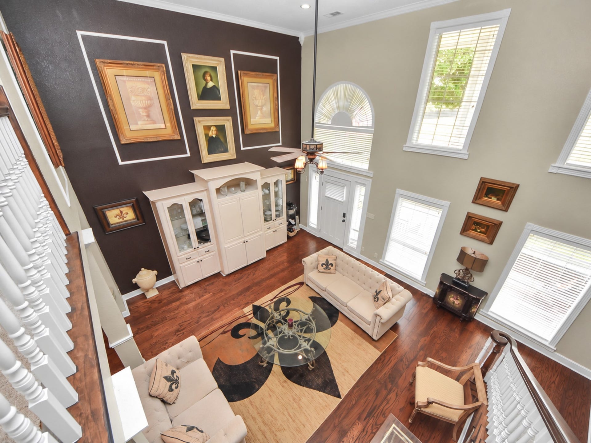 1910 Avenue L, Santa Fe, TX 77510 Main home Living area , with multiple windows for sunlight , and high ceilings that give it the luxurious vibe!
