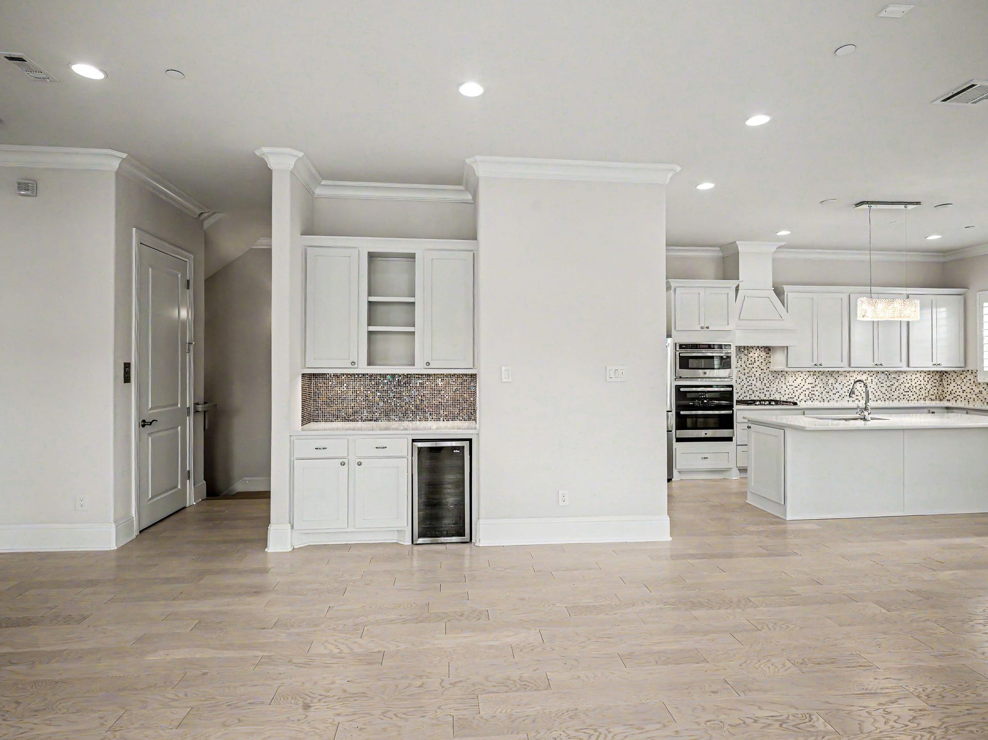The beverage station has many uses, along with cabinet space above.