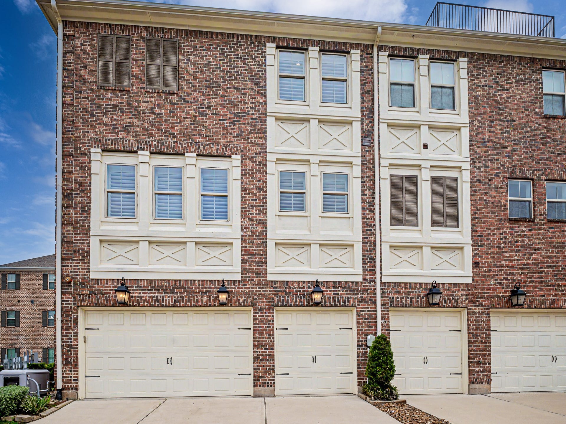 Garage doors down & outside lights on. Full home generator system located on the left.
