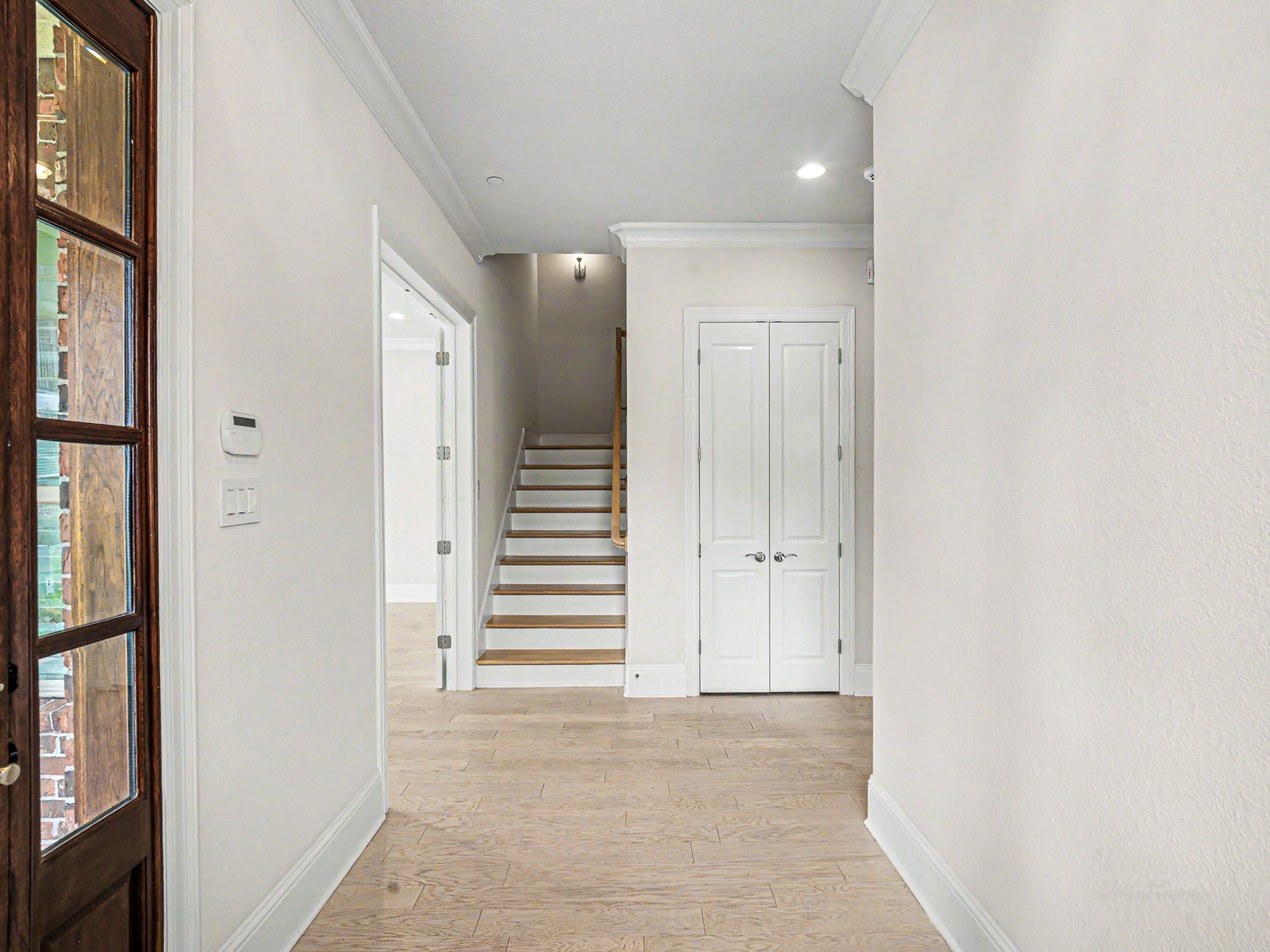 Entering into the spacious foyer that brings together the entire 1st floor together.