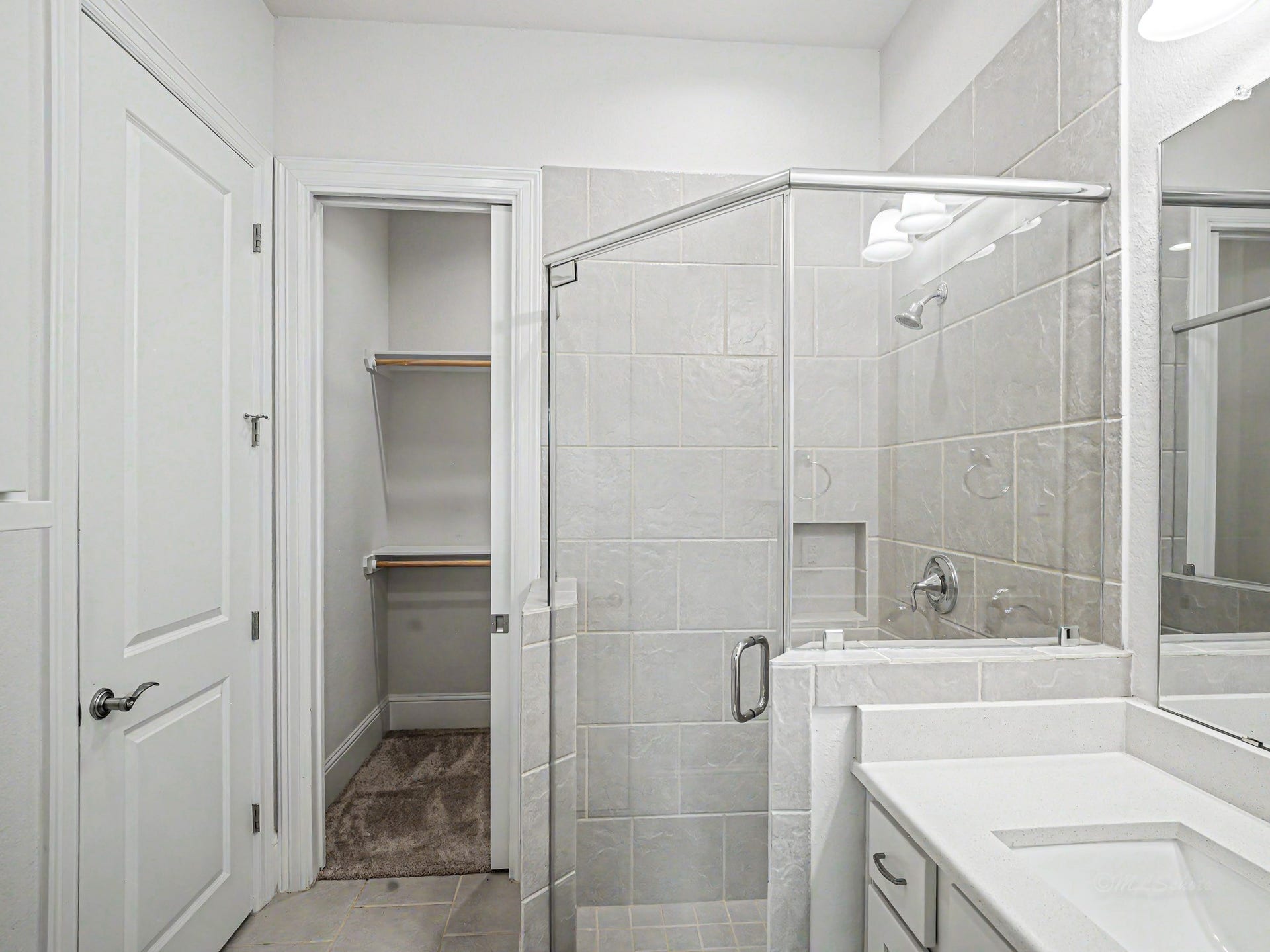 The walk-in closet with a pocket door gives you plenty of space.