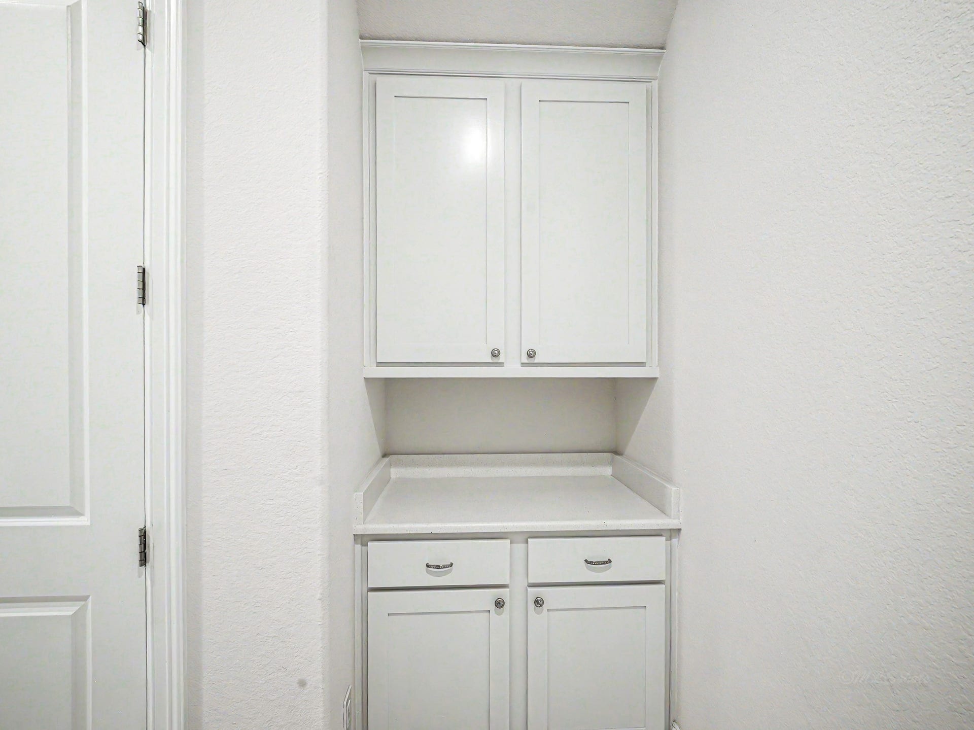 Next to the elevator is a drop zone area coming in from your 3-car garage.