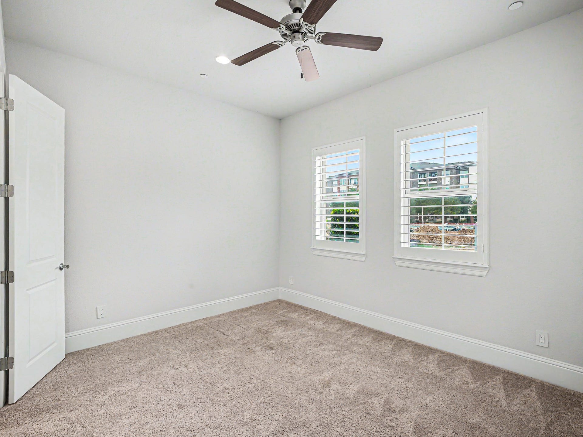 The bedroom is approximately 12 X 10 with two large windows adorned with Plantation Shutters.