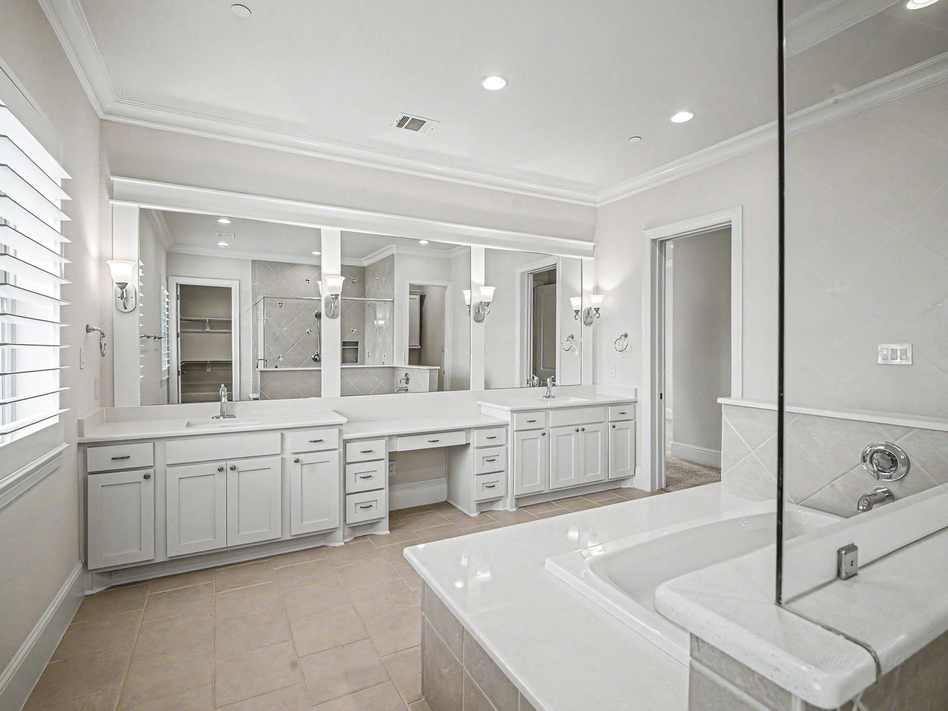 Plenty of cabinet space & mirrors.