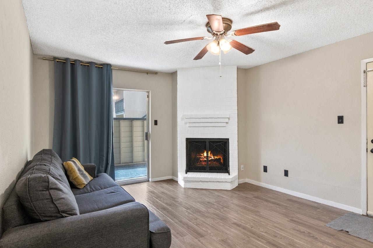 250 El Dorado Boulevard, #259, Webster, TX 77598 Wood log fireplace presents the perfect centerpiece