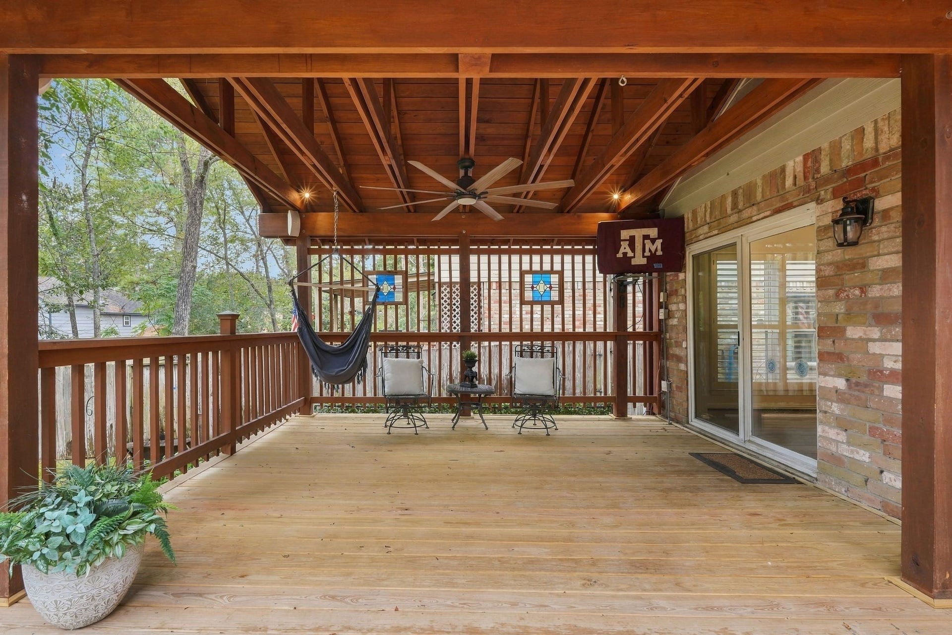 8 Diamond Oak Court, The Woodlands, TX 77381 Another view of the covered patio. Relax, enjoy nature and watch the football games!