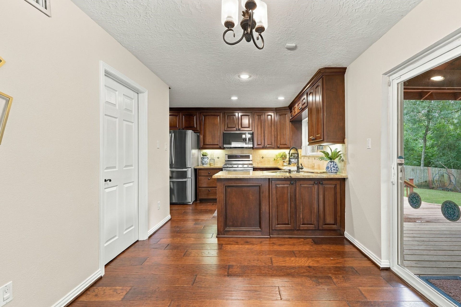 8 Diamond Oak Court, The Woodlands, TX 77381 Open dining and kitchen area with plenty of natural light and space for everyday gatherings.