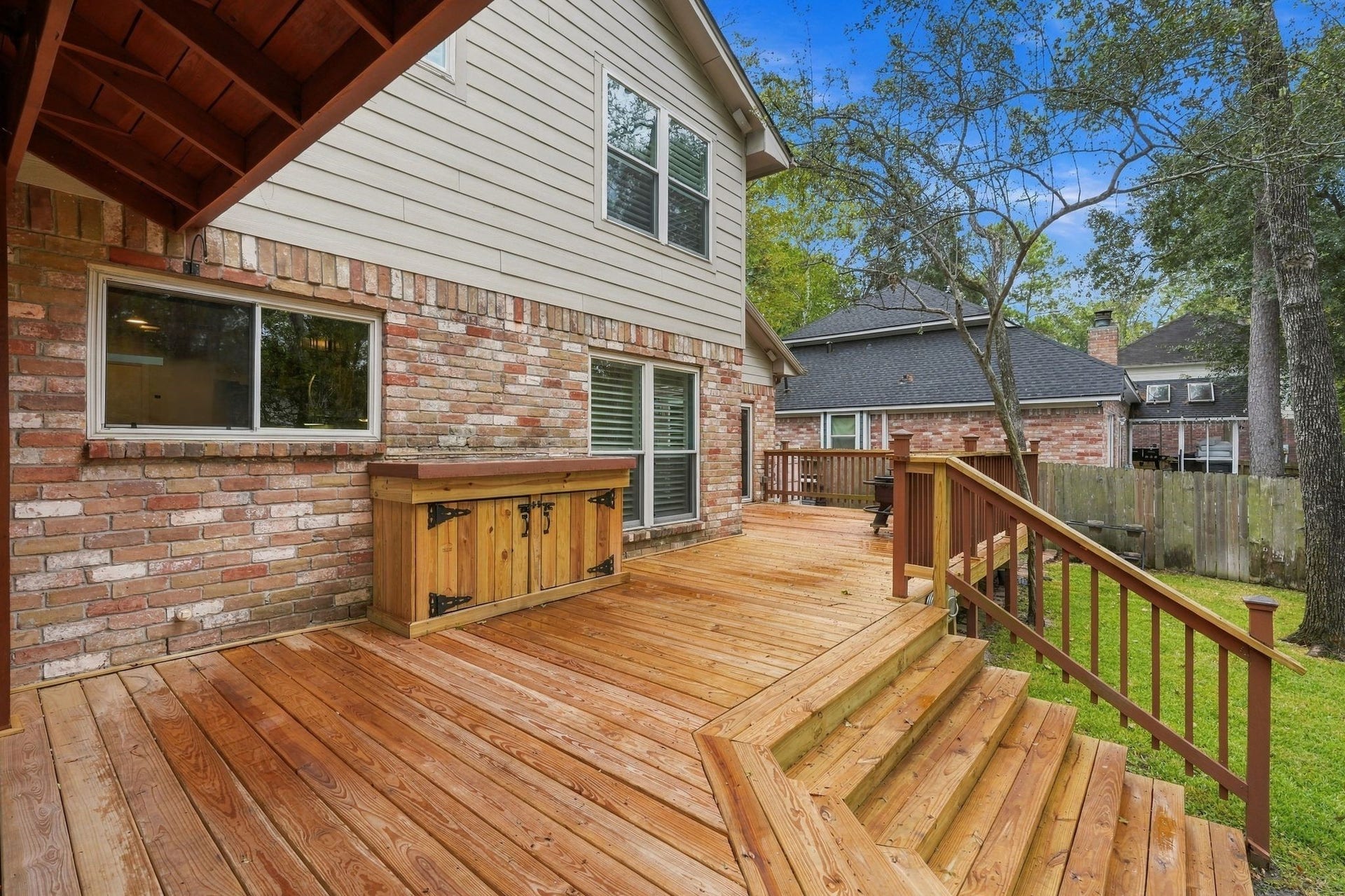 8 Diamond Oak Court, The Woodlands, TX 77381 Expansive wooden deck offering plenty of room for outdoor gatherings and enjoying the backyard views. Deck was just recently installed.