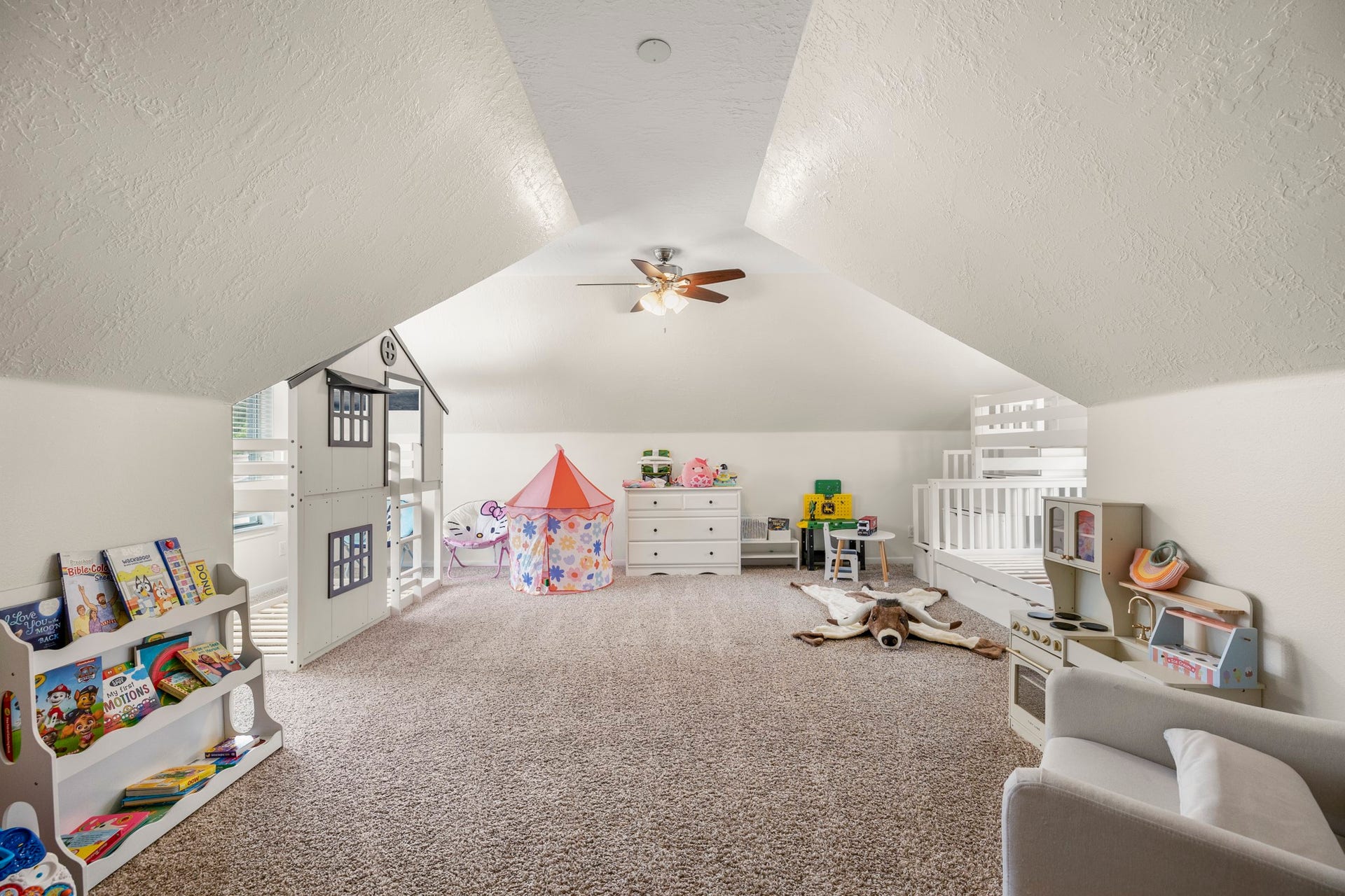 31219 Edgewater Drive, Magnolia, TX 77354 Upstairs, the generous bonus room offers flexible space beneath its sloped ceiling.
