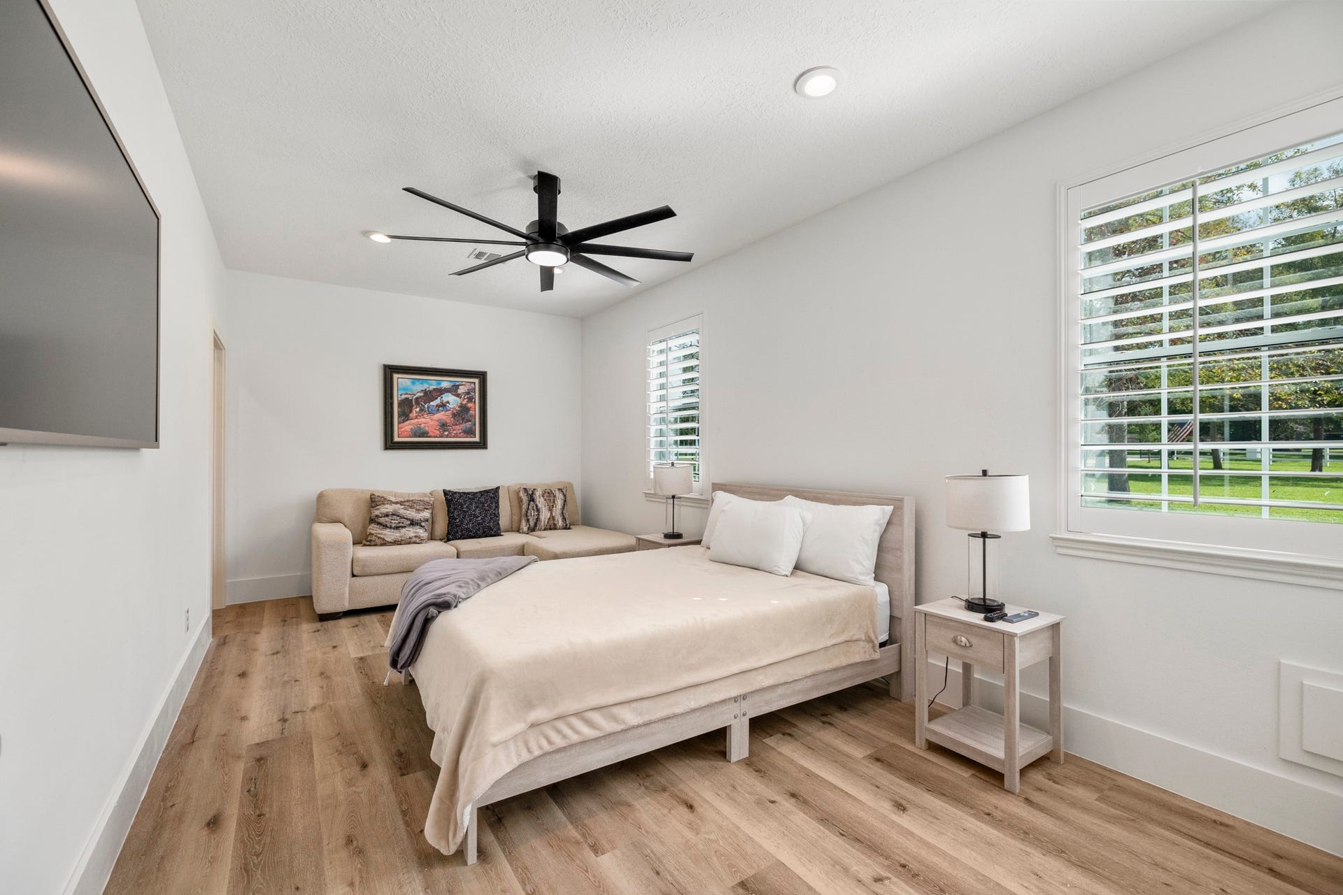 31219 Edgewater Drive, Magnolia, TX 77354 This bedroom has two windows that bring in natural light and views of the property.