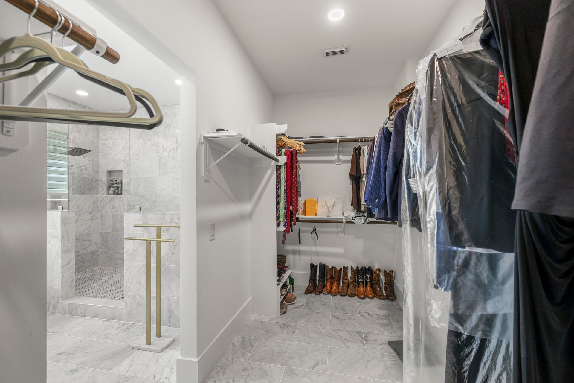 31219 Edgewater Drive, Magnolia, TX 77354 The walk-in closet provides built-in shelving and ample hanging space.