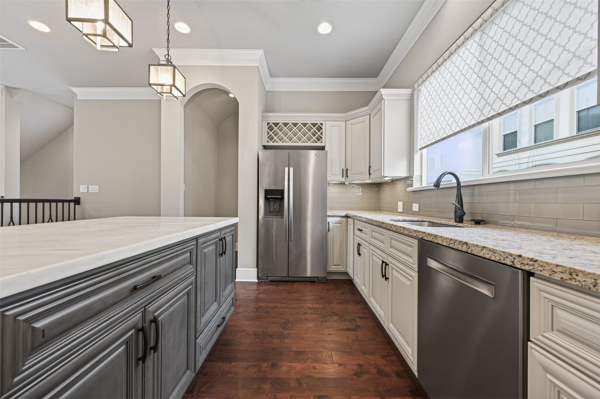 1429 W 21st Street, Houston, TX 77008 Look at this huge window over the sink and countertop! The archway shown in background is a hallway to the powder room.