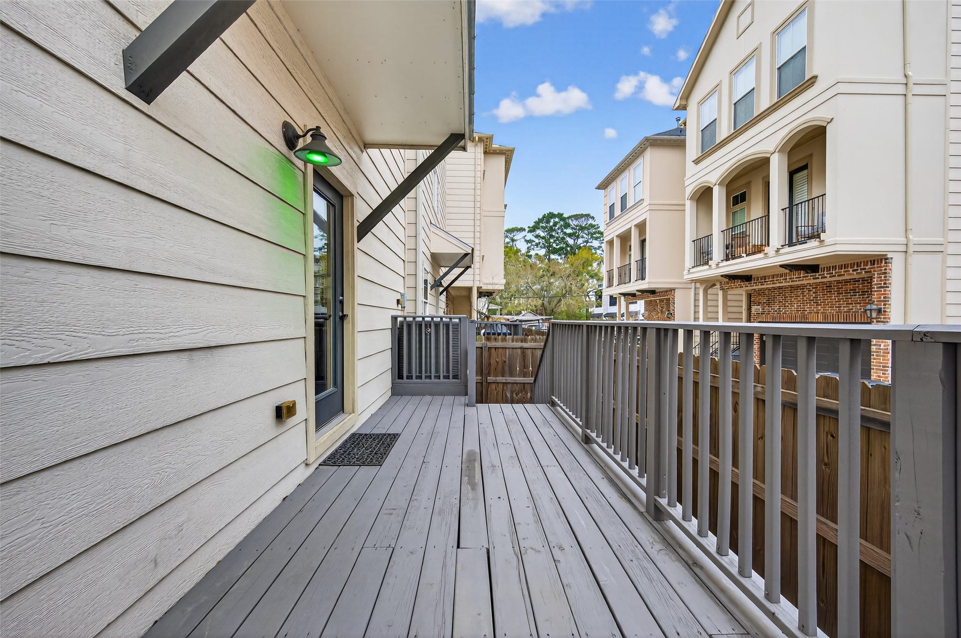 1429 W 21st Street, Houston, TX 77008 An opposite view of the deck showing the steps to the ground level and pool access.