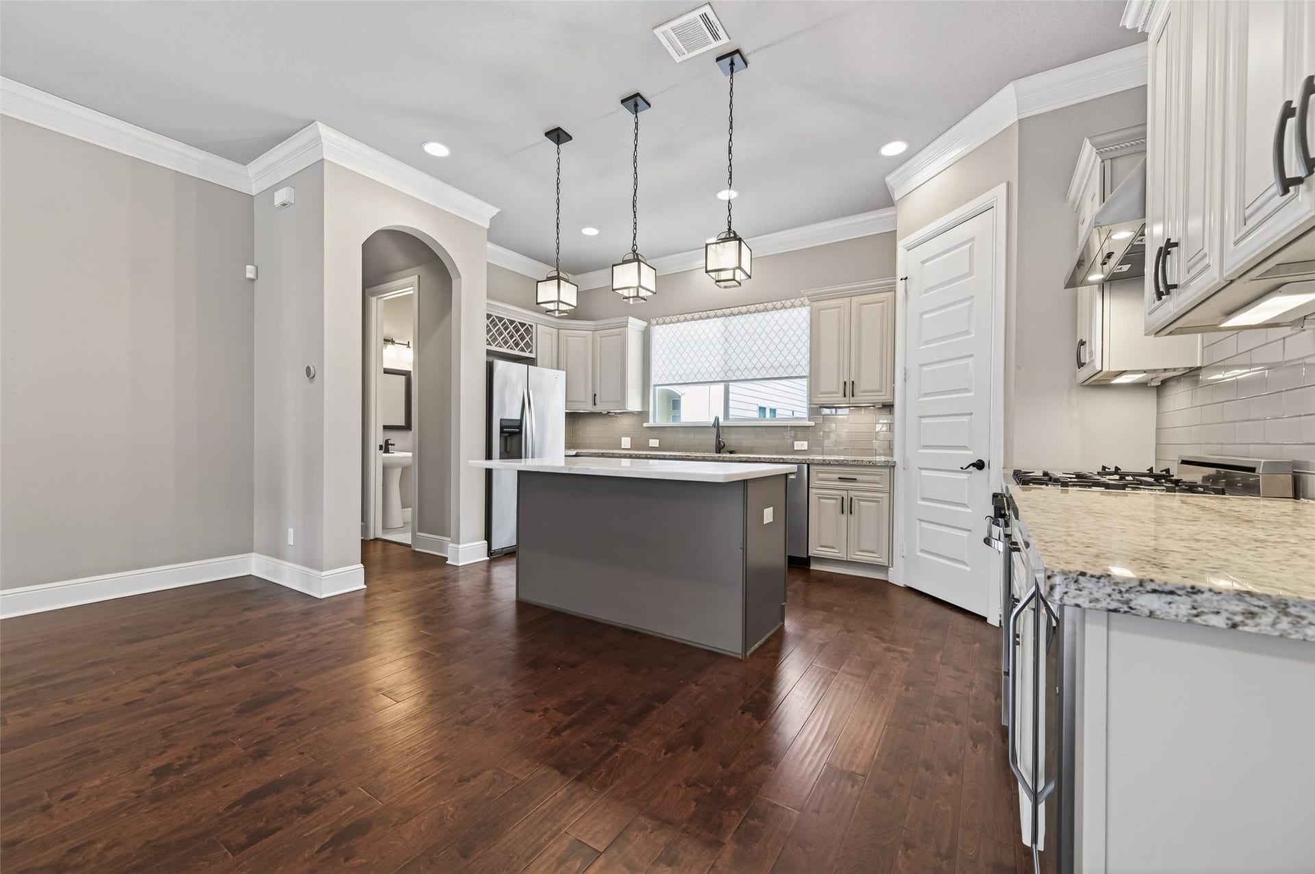1429 W 21st Street, Houston, TX 77008 Spacious kitchen includes all the appliances you see here -- refrigerator, wine fridge, gas range, microwave/hood, and dishwasher.