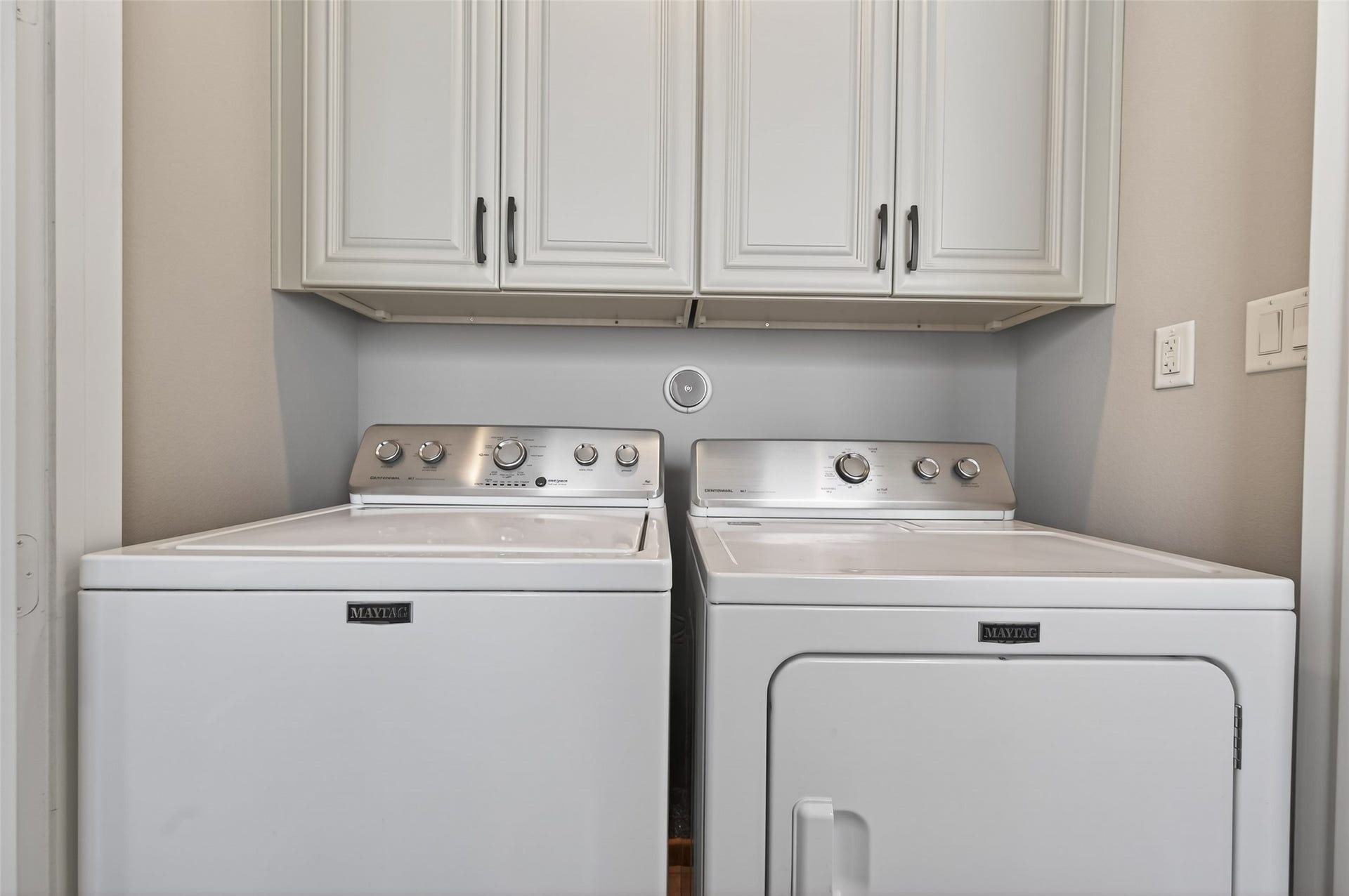 1429 W 21st Street, Houston, TX 77008 Laundry room offers storage cabinets above. Washer and dryer are included.