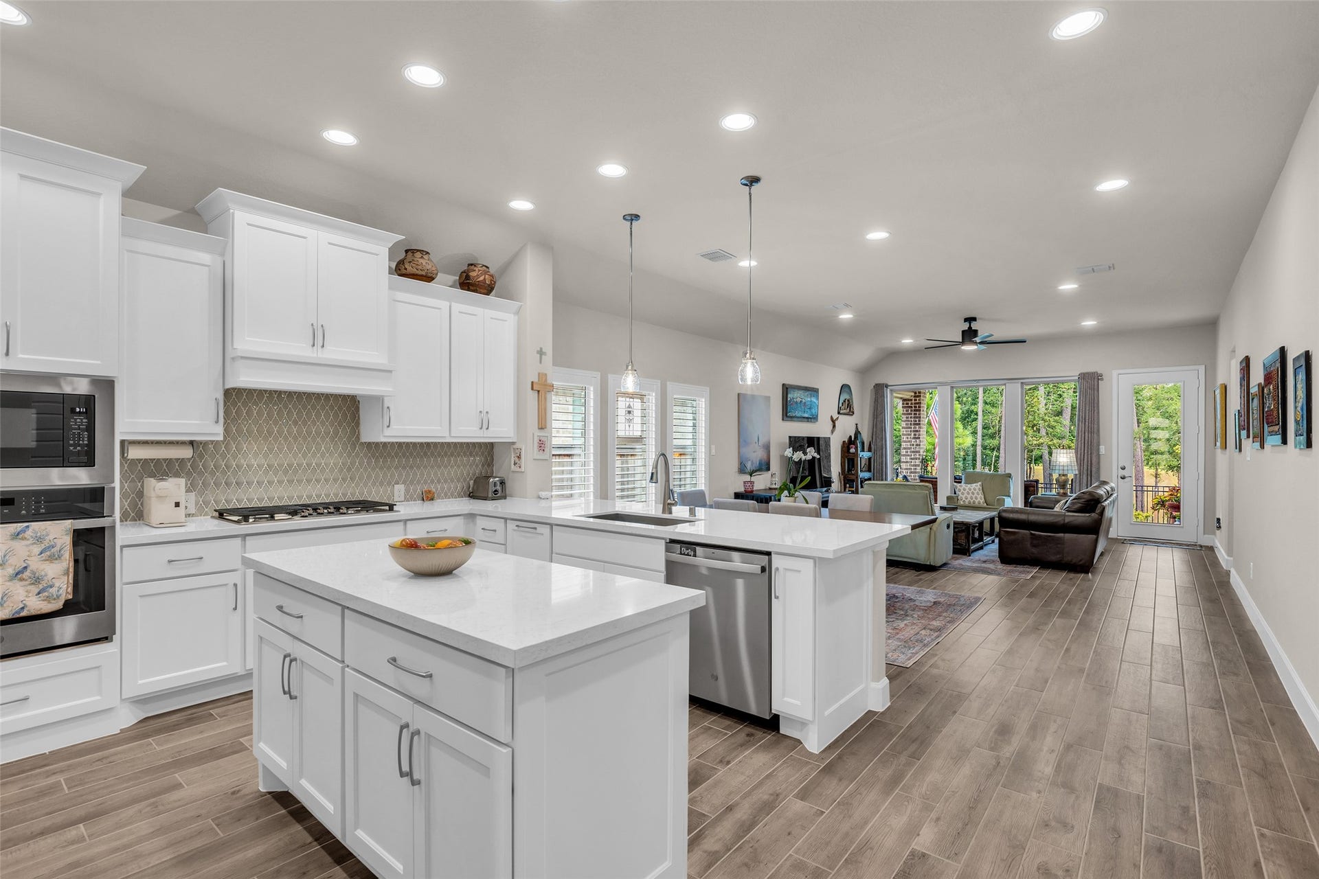 14858 Whistling Duck Lane, Magnolia, TX 77354 The open concept design flows seamlessly from kitchen to living area.