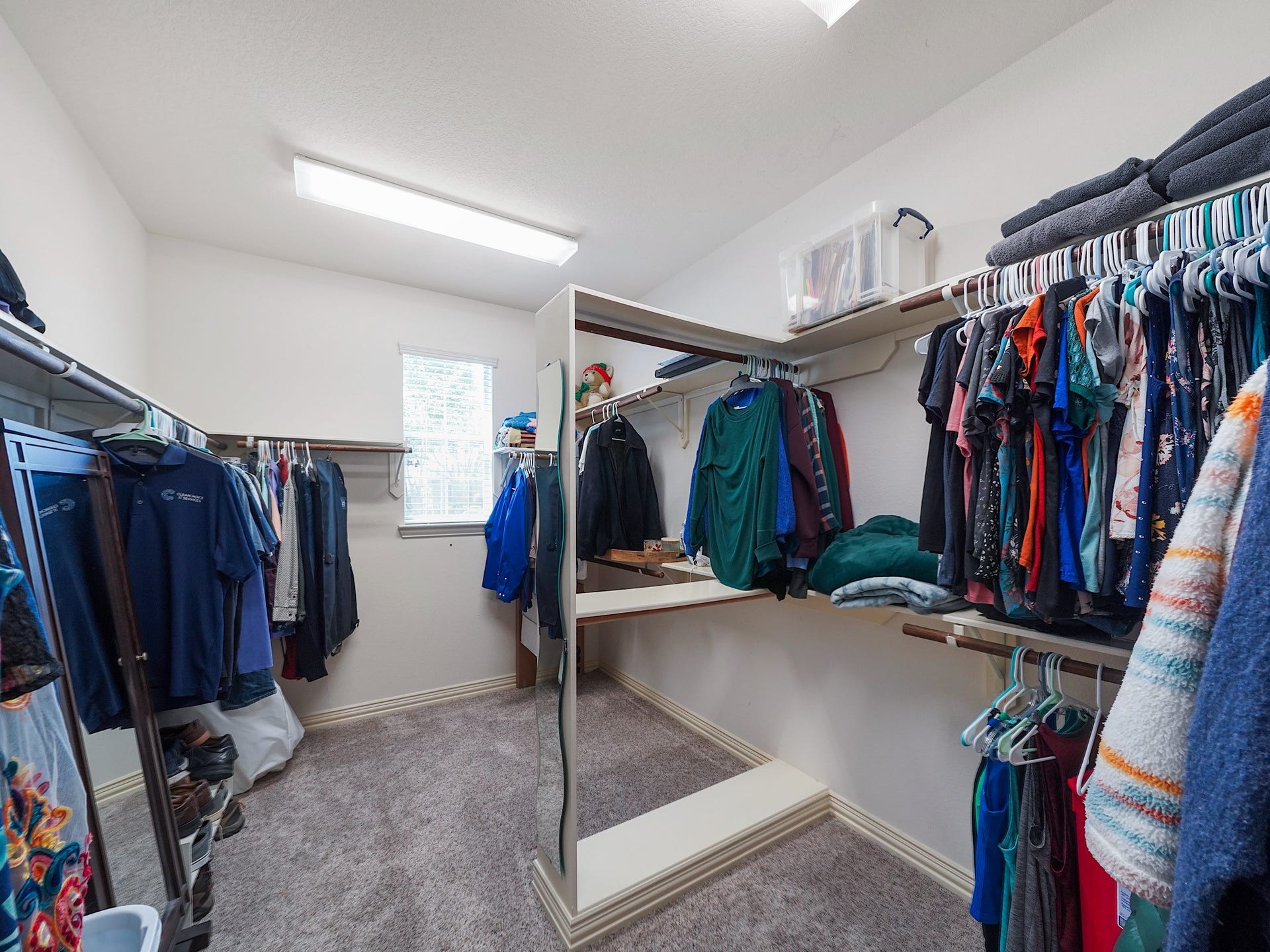 26214 Seminole Hill Lane, Katy, TX 77494 An oversized walk-in closet offers exceptional storage and organization for every season.