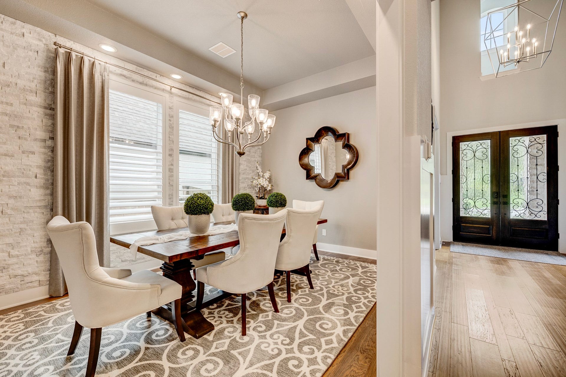 121 Sugar Pine Court, Montgomery, TX 77316 The dining room features a sophisticated stone accent wall complemented by elegant plantation shutters.
