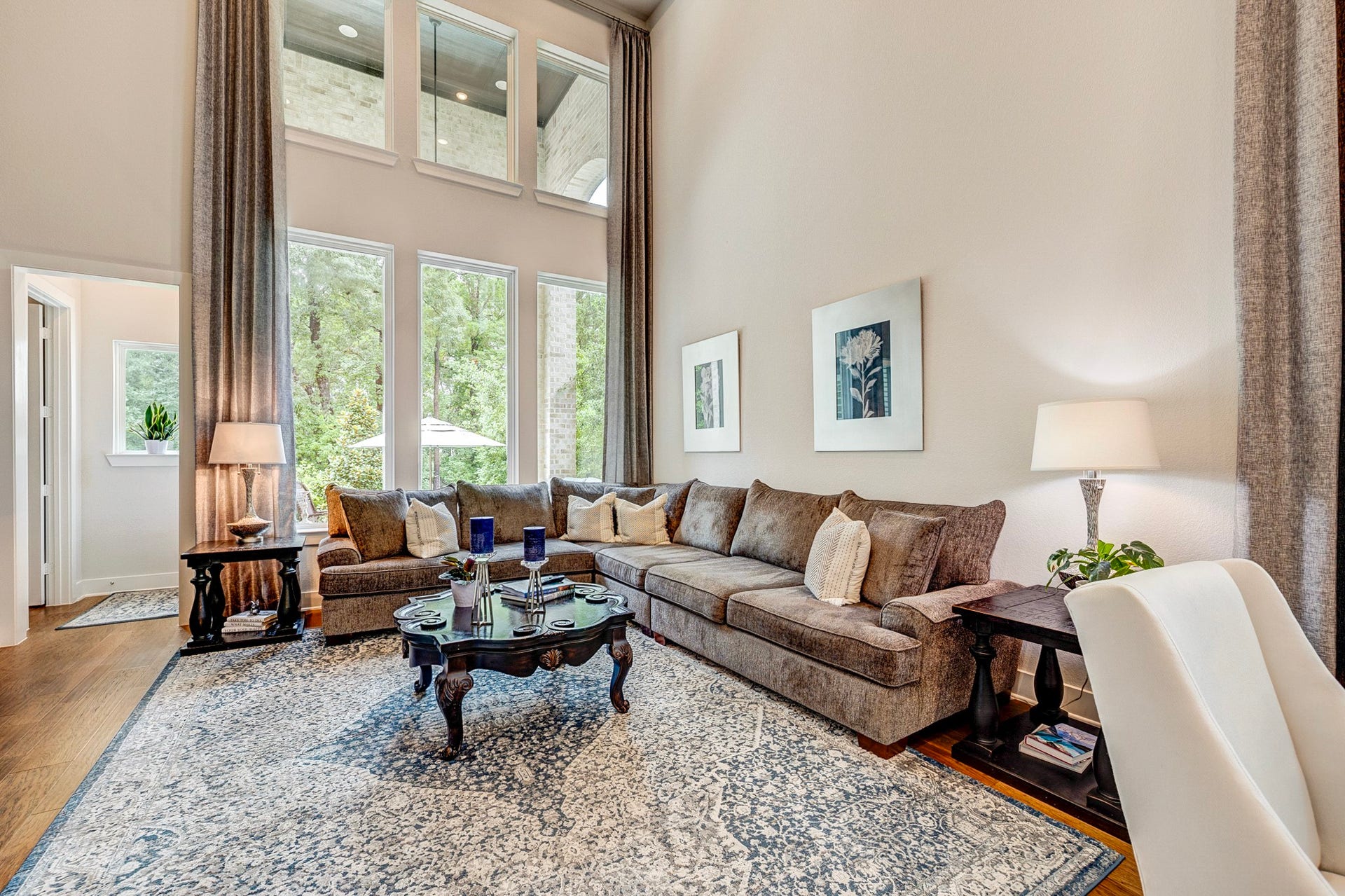 121 Sugar Pine Court, Montgomery, TX 77316 The family room is filled with abundant natural light and features an open-concept layout that flows seamlessly into the kitchen.