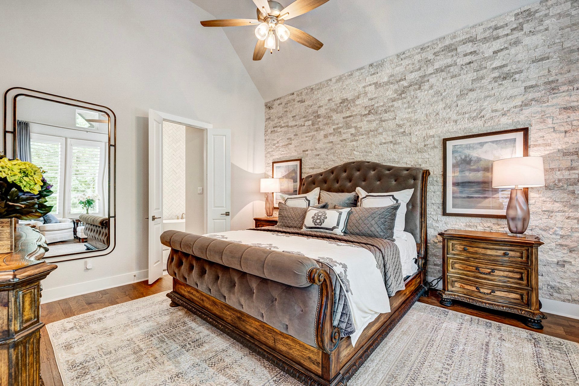 121 Sugar Pine Court, Montgomery, TX 77316 Primary suite features an en suite bathroom oasis and upgraded stone accent wall for texture and design
