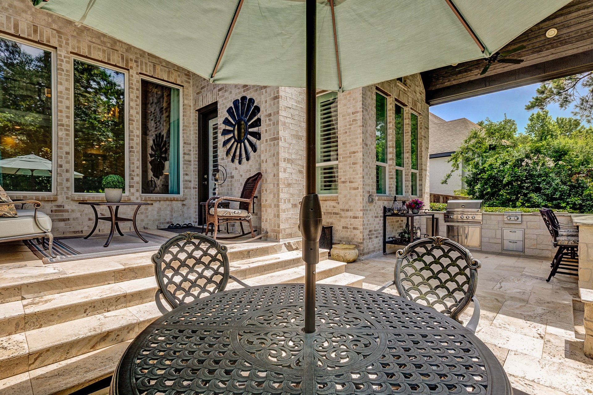 121 Sugar Pine Court, Montgomery, TX 77316 Step down from the covered back patio to the bar at the outdoor kitchen