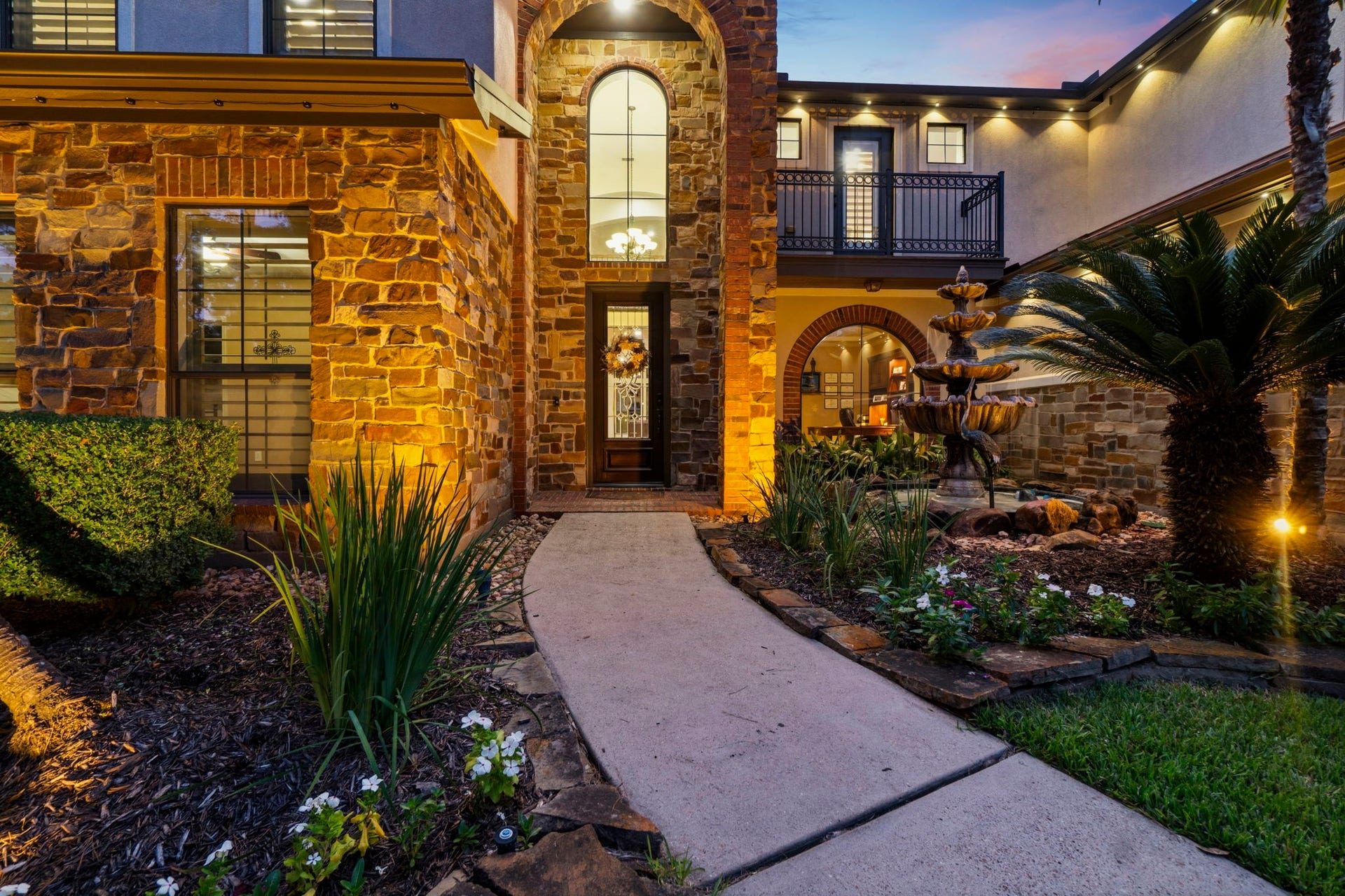 11612 Princess Ann Court, Montgomery, TX 77316 Private courtyard entry with a stunning four-tier fountain.