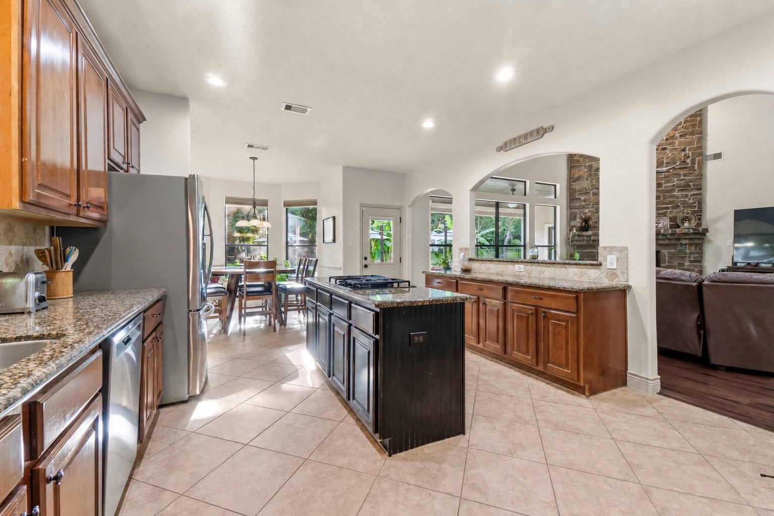 11612 Princess Ann Court, Montgomery, TX 77316 The gourmet kitchen opens seamlessly to the breakfast area and family room, making it perfect for entertaining and everyday living.