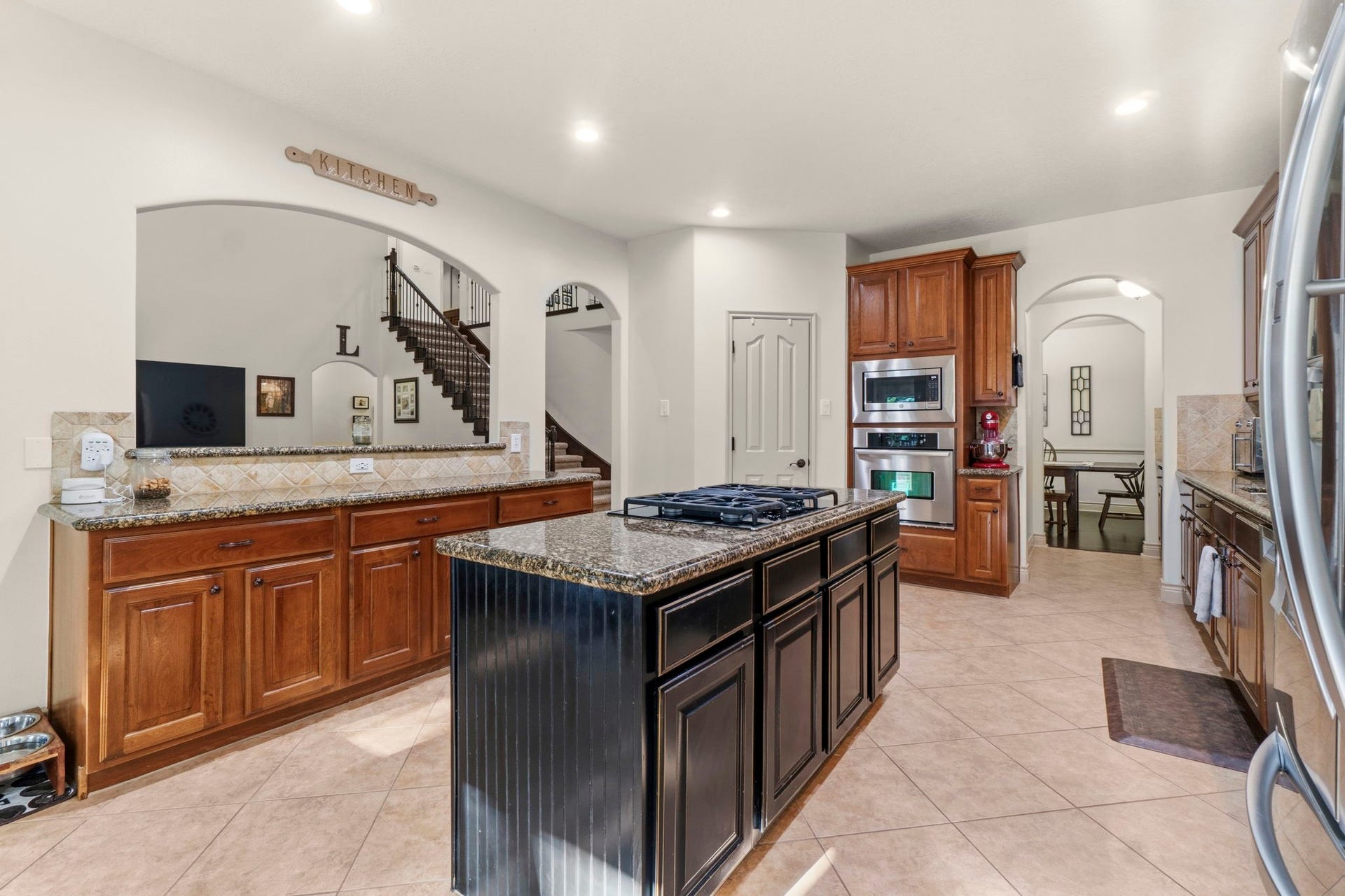 11612 Princess Ann Court, Montgomery, TX 77316 Abundant cabinetry, walk-in pantry, and a spacious layout designed for entertaining.
