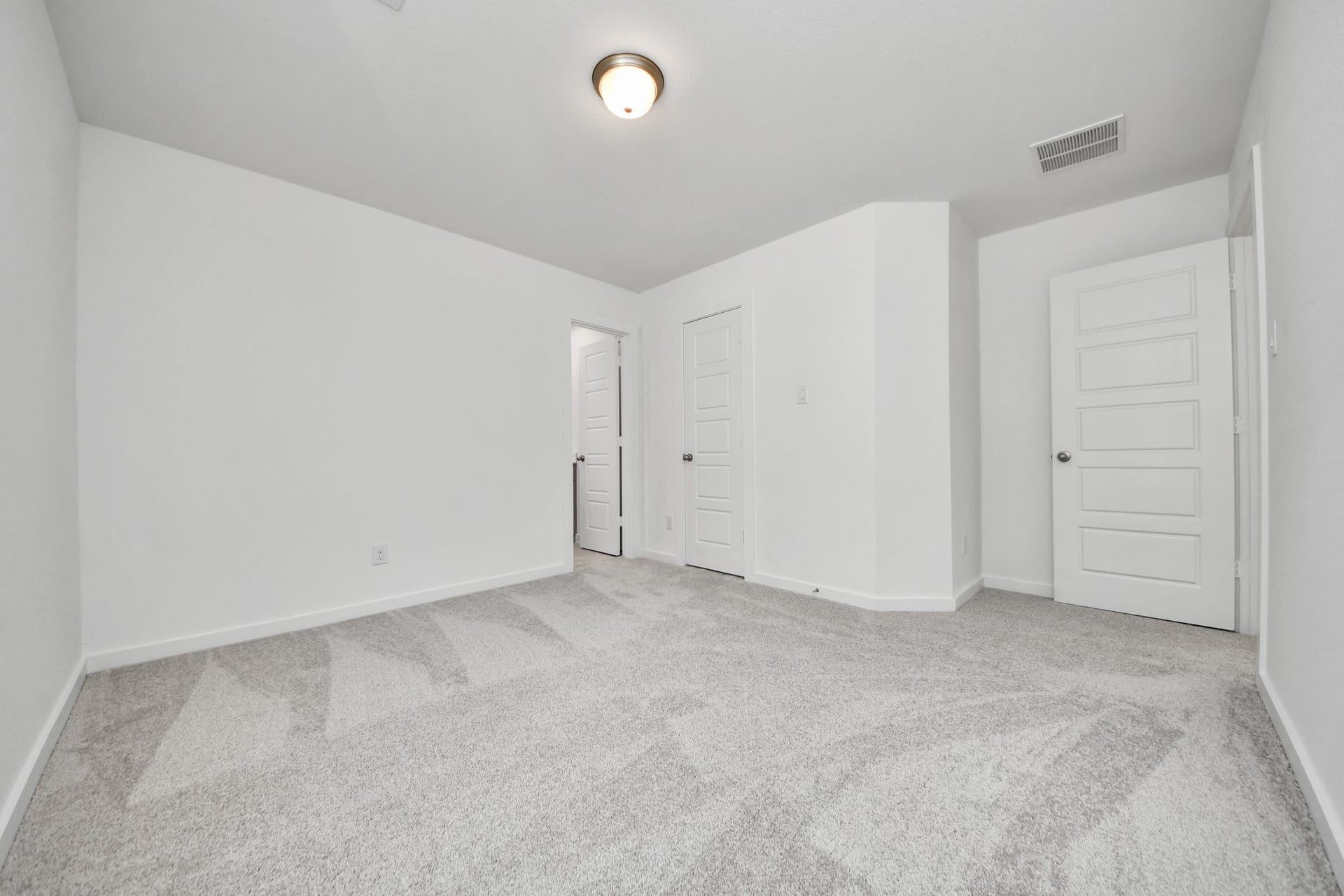 2114 Della Lakes Court, Fresno, TX 77545 Generously sized secondary bedrooms featuring spacious closets, soft and inviting carpeting underfoot, large windows allowing plenty of natural light, and the added touch of privacy blinds for your personal retreat. Sample photo of completed home with similar floor plan. Actual colors and selections may vary.