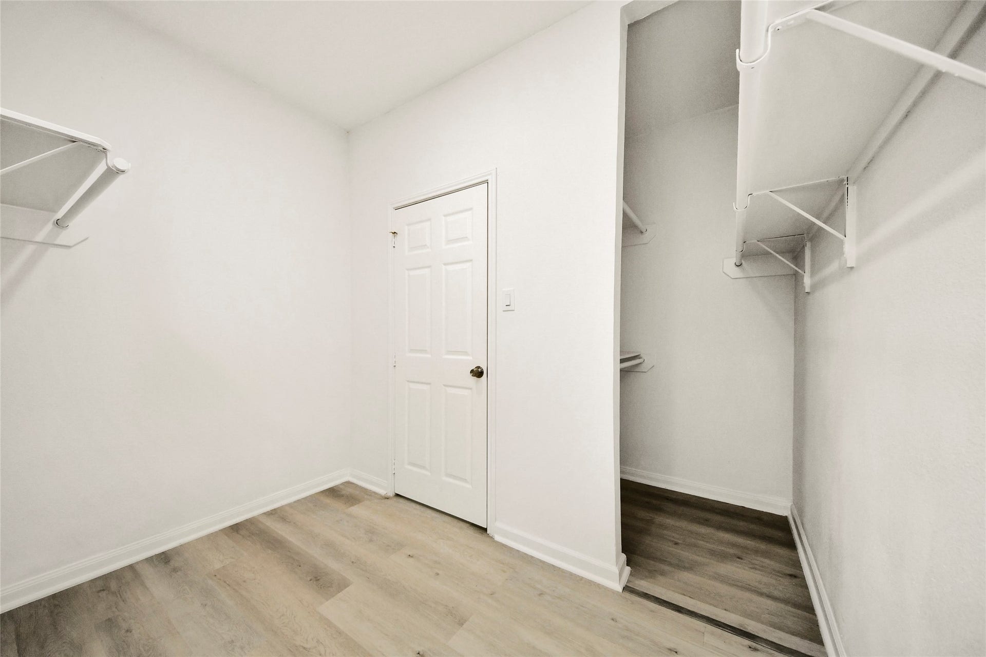 4615 Collingsworth Street, #AB, Houston, TX 77026 Spacious walk-in closet with ample shelving and a modern, clean design. Perfect for organizing your wardrobe.