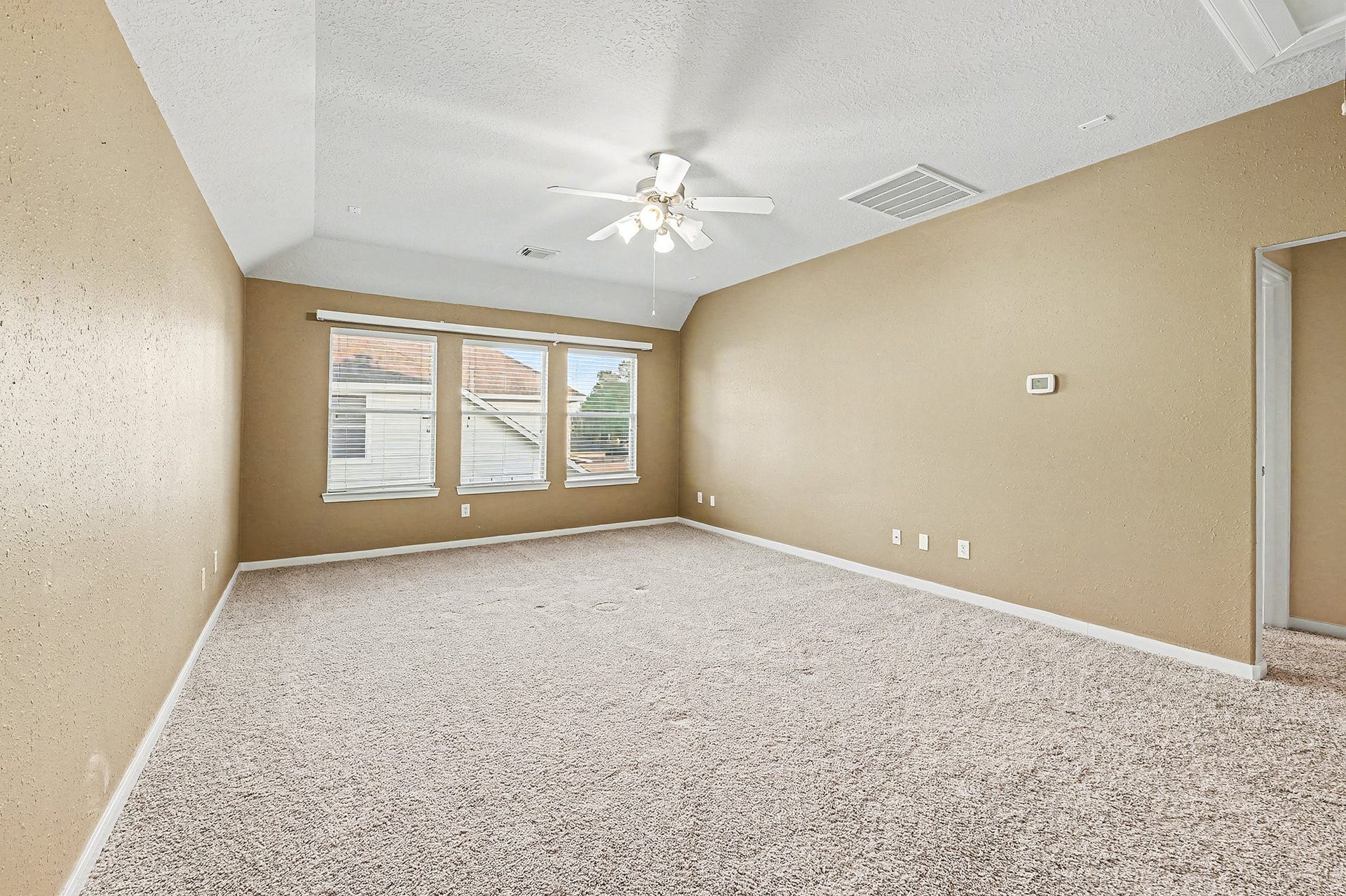 One view of oversized gameroom without furniture.