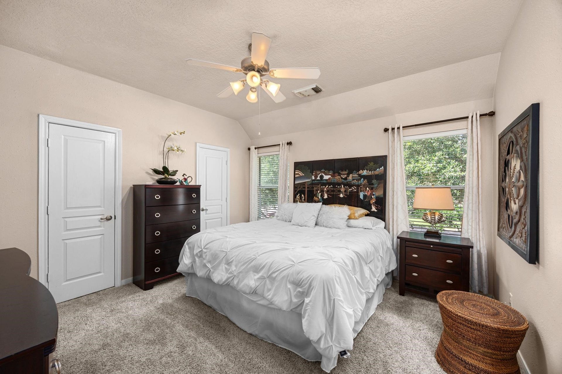 This very light sizable secondary bedromm has freize carpet and walk-in closet.