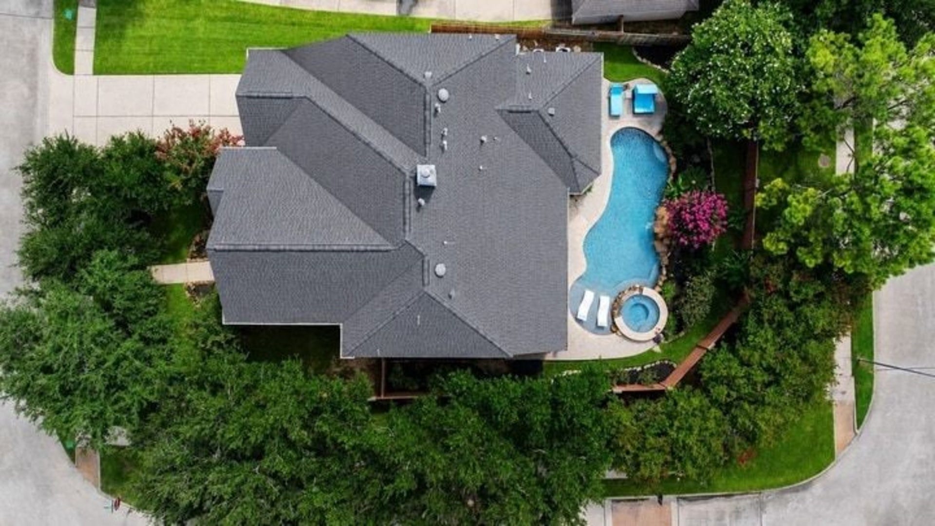 This could be your fabulous home!
Great arial view of home showing the spacious corner lot 
outlined with lots of mature shade trees, great view of pool/spa and beautiful maintained flowering landscaped yard.