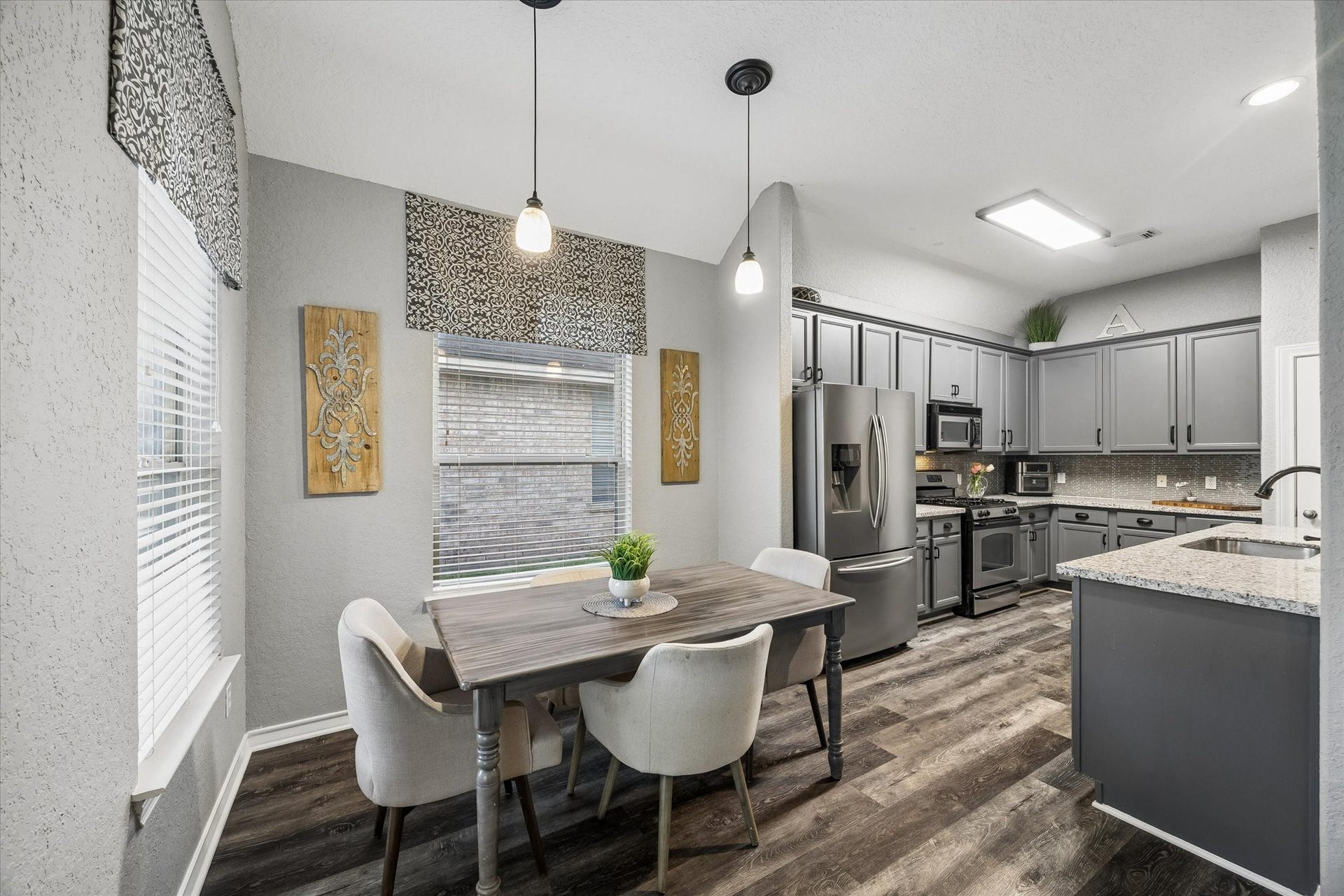5115 Redleaf Forest Lane, Katy, TX 77494 The breakfast area features abundant natural light, stylish pendant lighting, and convenient access to the updated kitchen, making it ideal for casual dining.