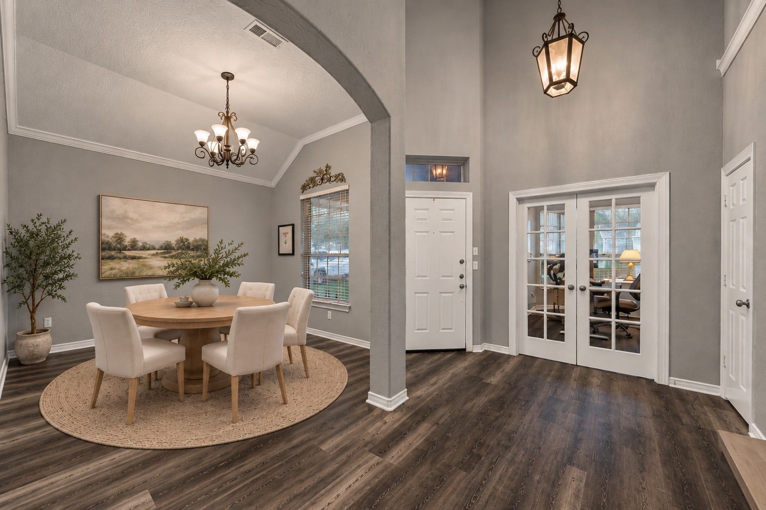 5115 Redleaf Forest Lane, Katy, TX 77494 This photo has been virtually staged to showcase the incredible potential of the formal dining room. Featuring a round dining table, upholstered seating, and tasteful dcor, the space beautifully illustrates how it can be transformed into an inviting setting for everyday dining and special gatherings.
