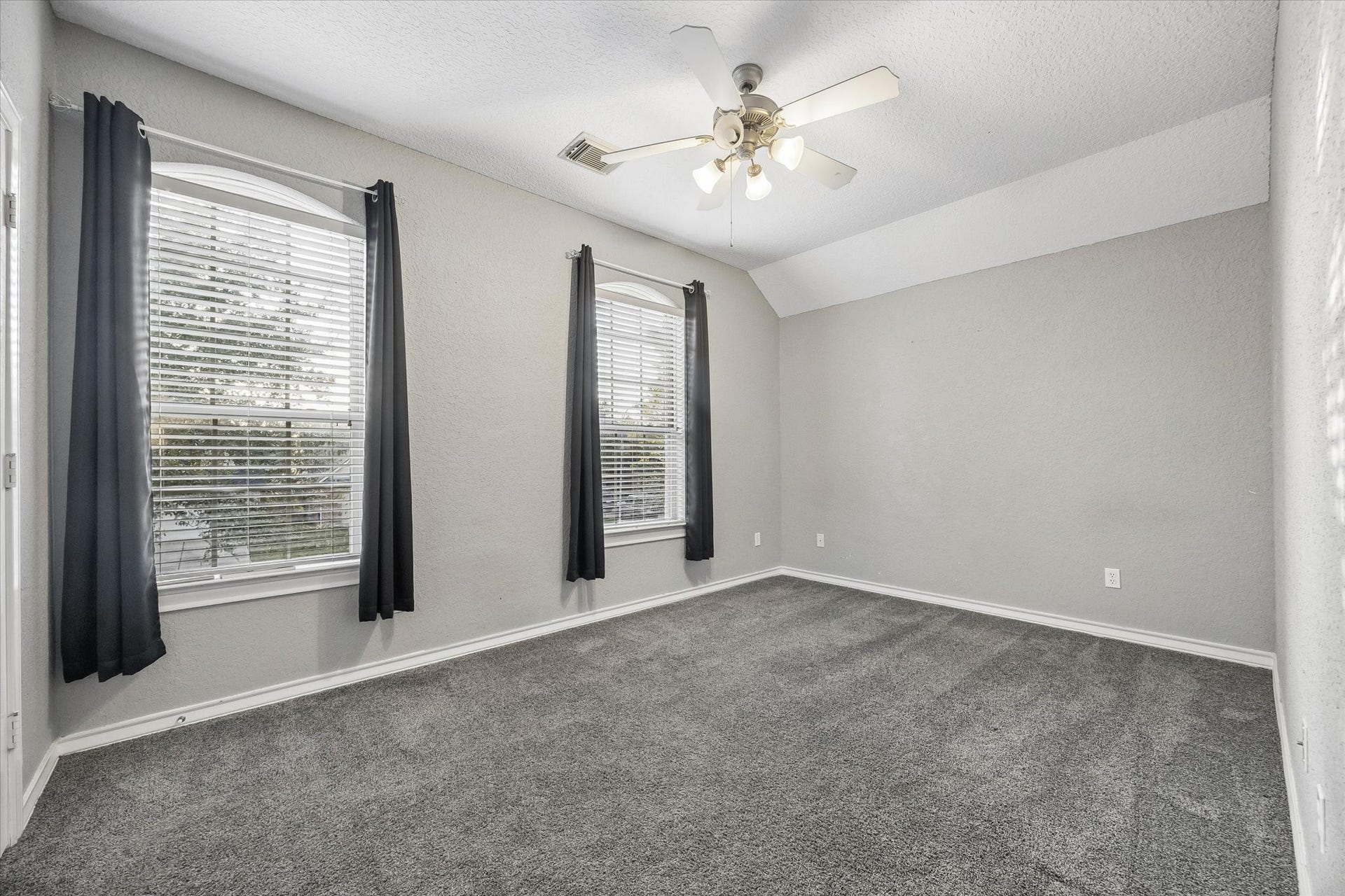 5115 Redleaf Forest Lane, Katy, TX 77494 This is the other upstairs secondary bedrooms with updated carpet, multiple windows, ceiling fan, walk-in closet and plenty of space!