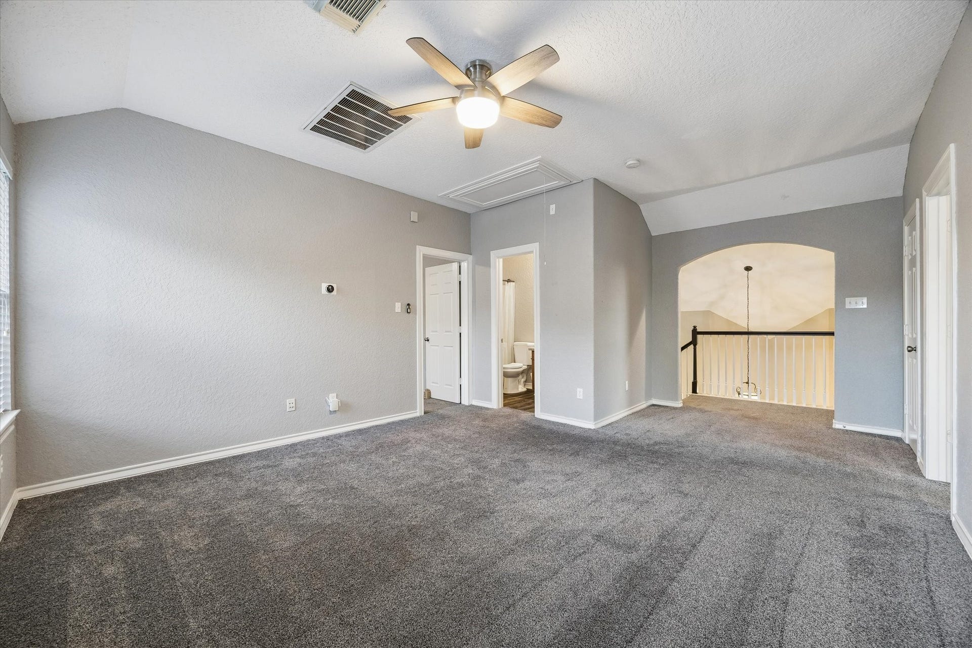 5115 Redleaf Forest Lane, Katy, TX 77494 Another view of the spacious upstairs game room with high ceilings, a full bathroom, and an open view overlooking the first floor.
