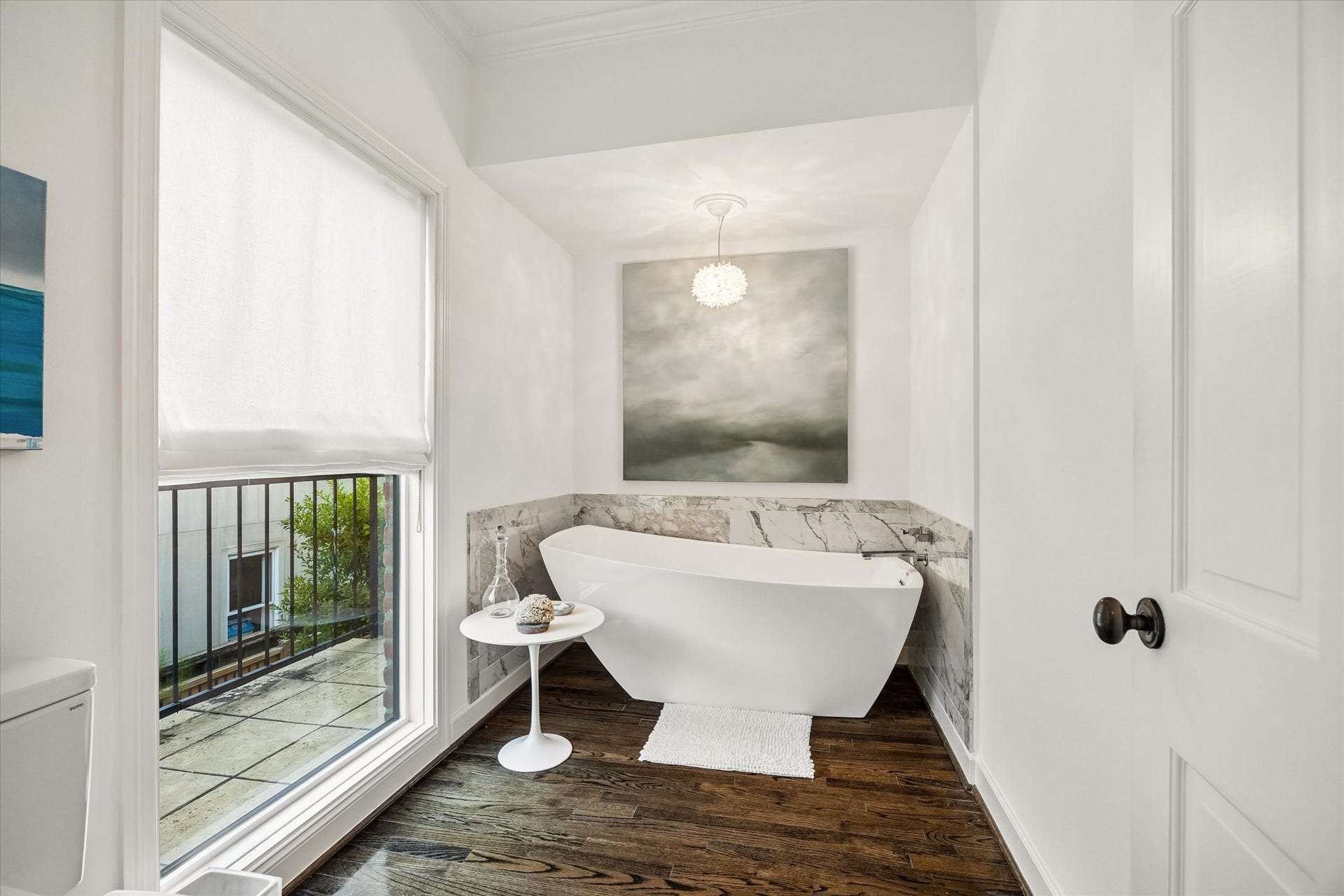 The Master Bath has dual Water Closets, one features a recent slipper tub...