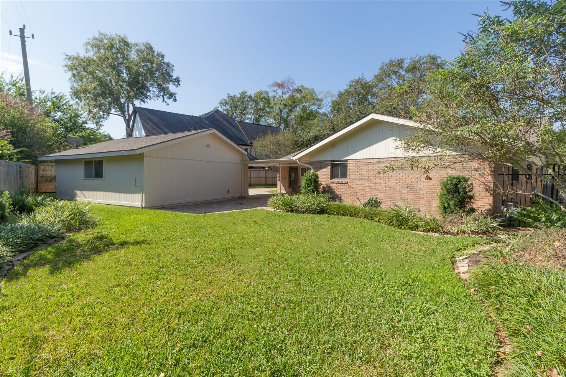8919 Manhattan Drive, Houston, TX 77096 Spacious backyard offers room for play, pets, gardening or future outdoor improvements.