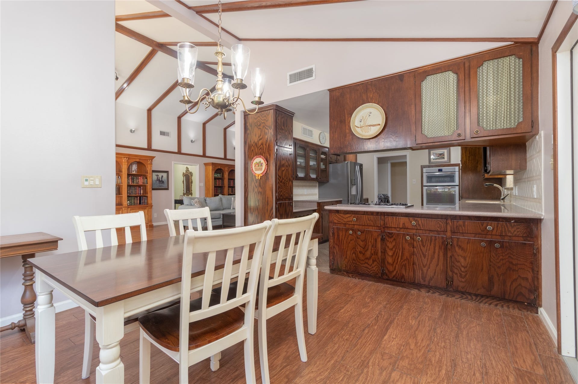8919 Manhattan Drive, Houston, TX 77096 Breakfast and dining area beneath the vaulted ceiling with easy access to the kitchen and backyard