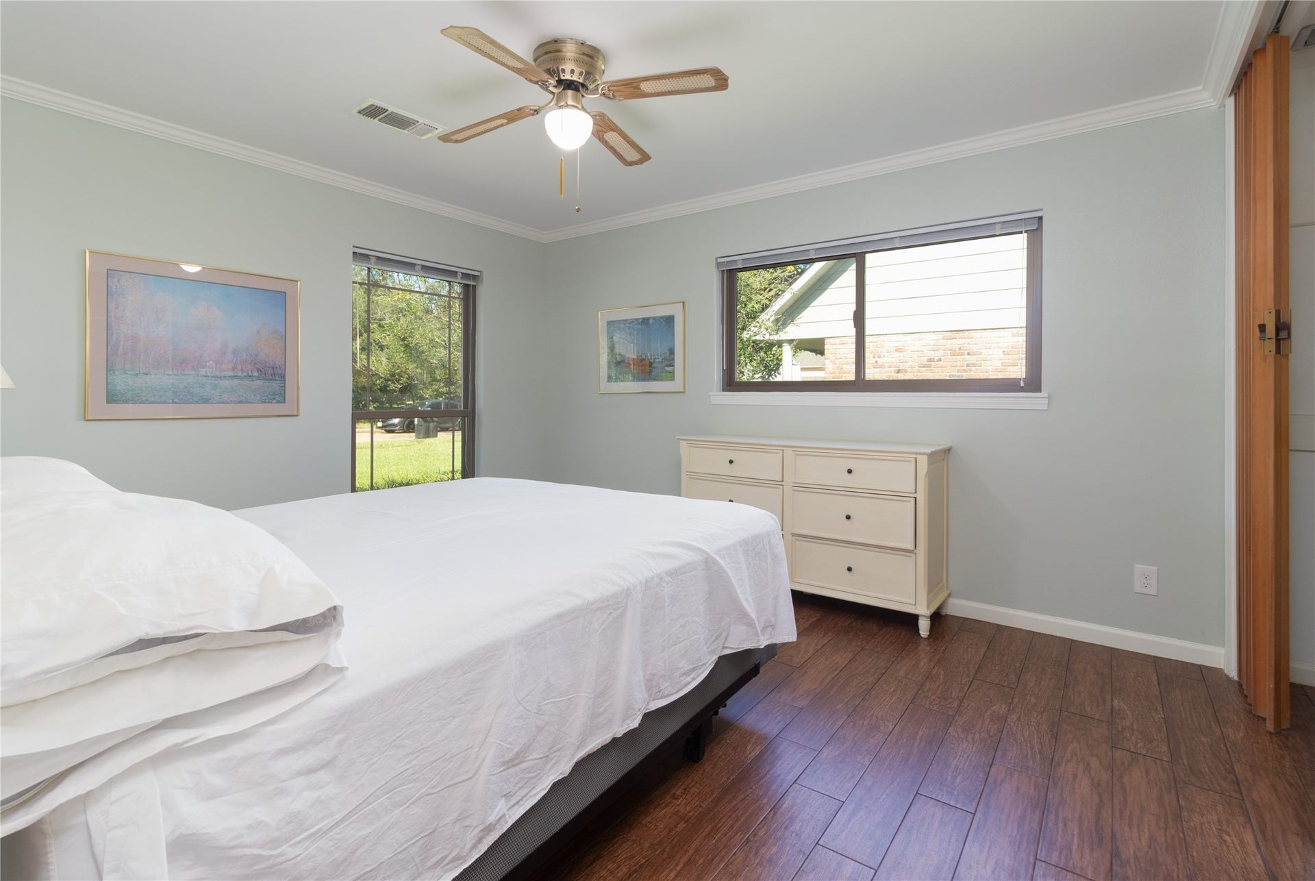 8919 Manhattan Drive, Houston, TX 77096 Bright secondary bedroom features multiple windows and attractive natural light.