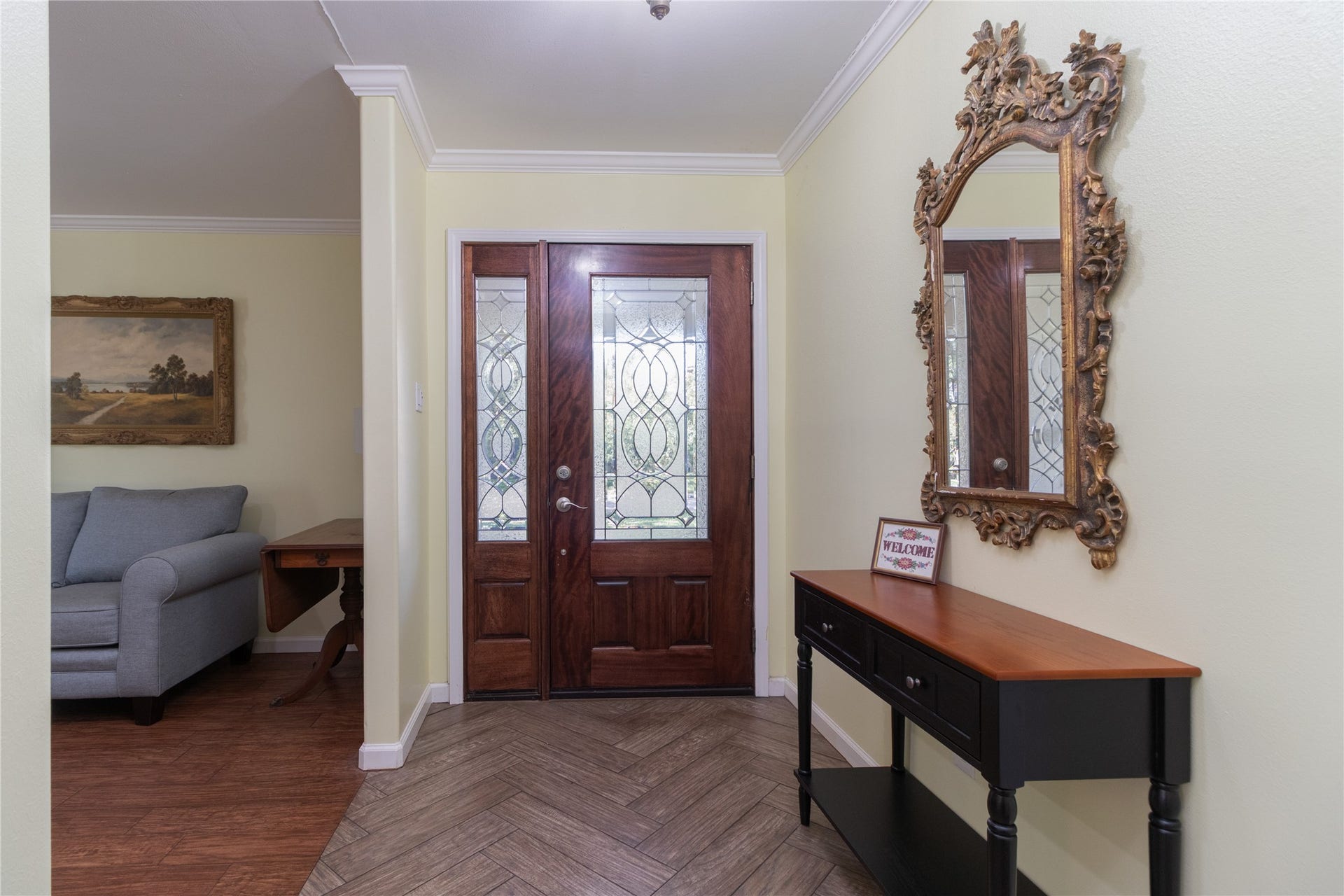 8919 Manhattan Drive, Houston, TX 77096 Looking toward the entry, decorative glass doors and architectural details add warmth and character