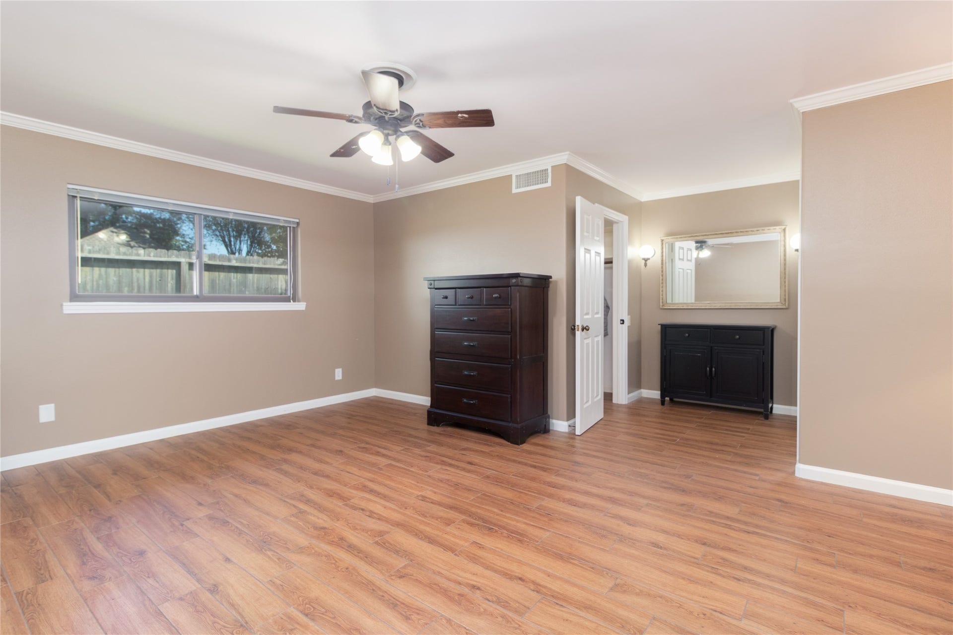8919 Manhattan Drive, Houston, TX 77096 Spacious primary bedroom offers exceptional flexibility for furniture placement.