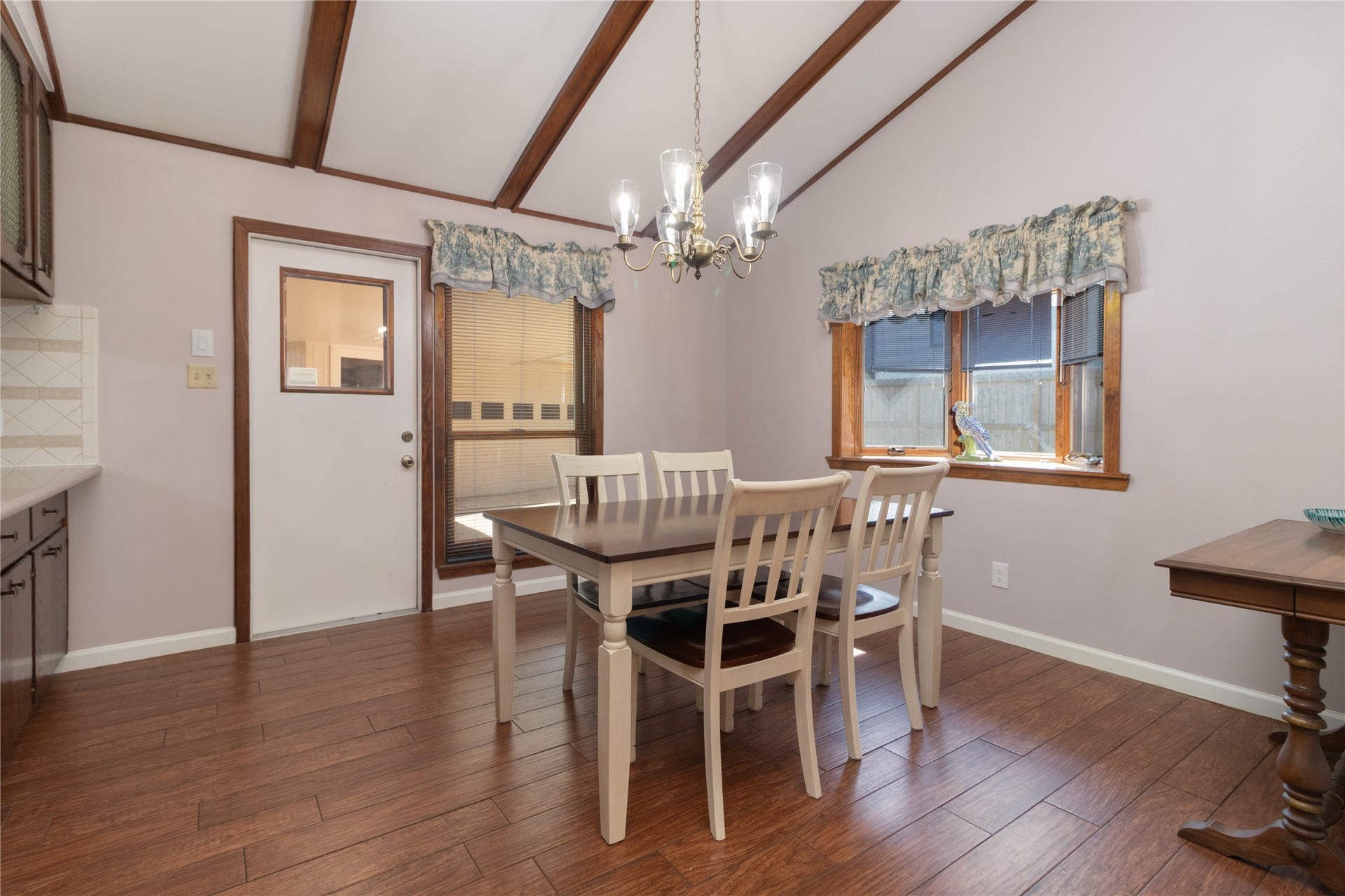 8919 Manhattan Drive, Houston, TX 77096 Breakfast and dining area beneath the vaulted ceiling with easy access to the kitchen and backyard
