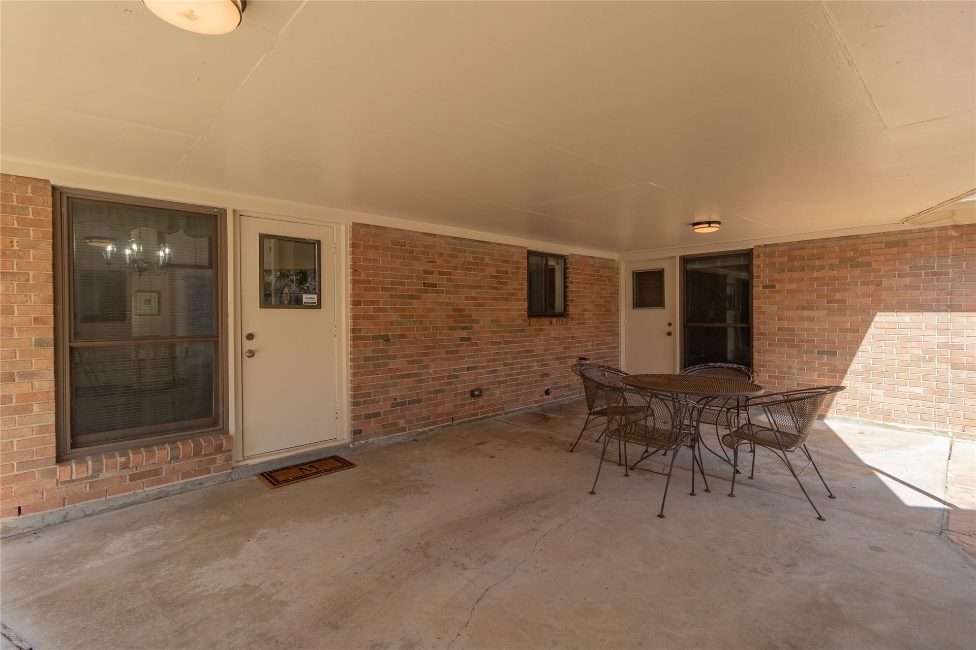 8919 Manhattan Drive, Houston, TX 77096 Large covered patio provides shaded space for outdoor dining and entertaining.